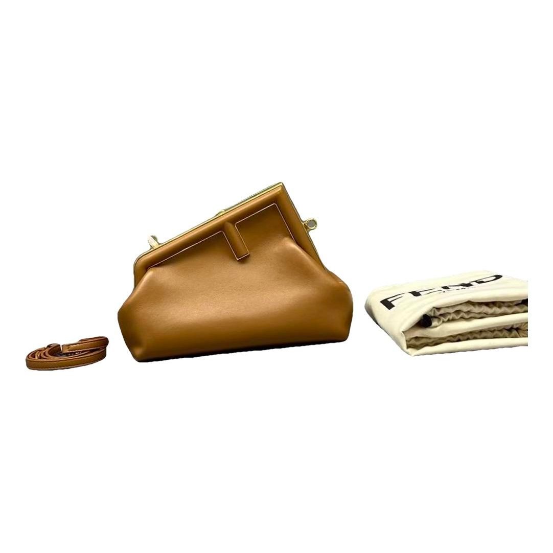 First leather handbag