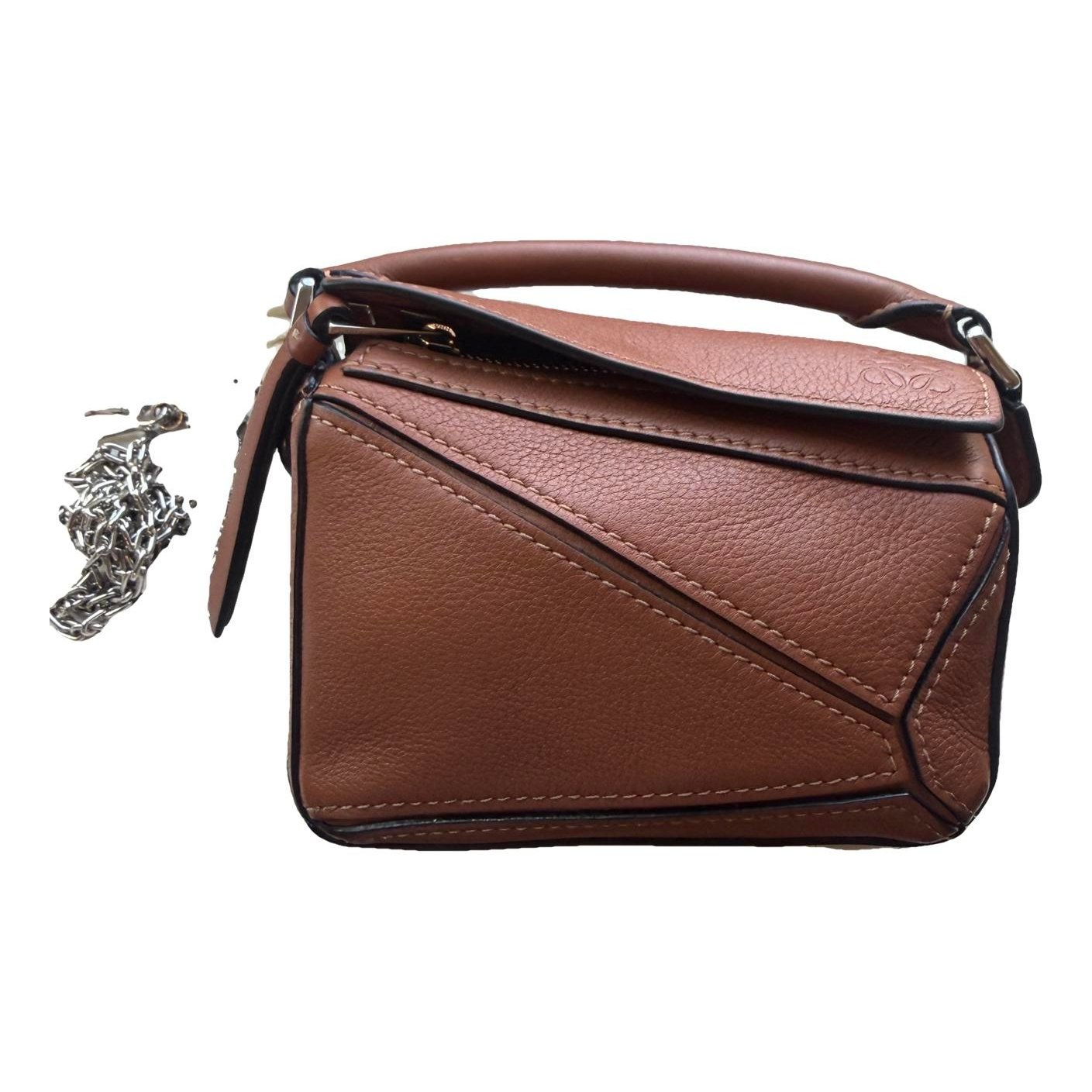 Puzzle leather handbag