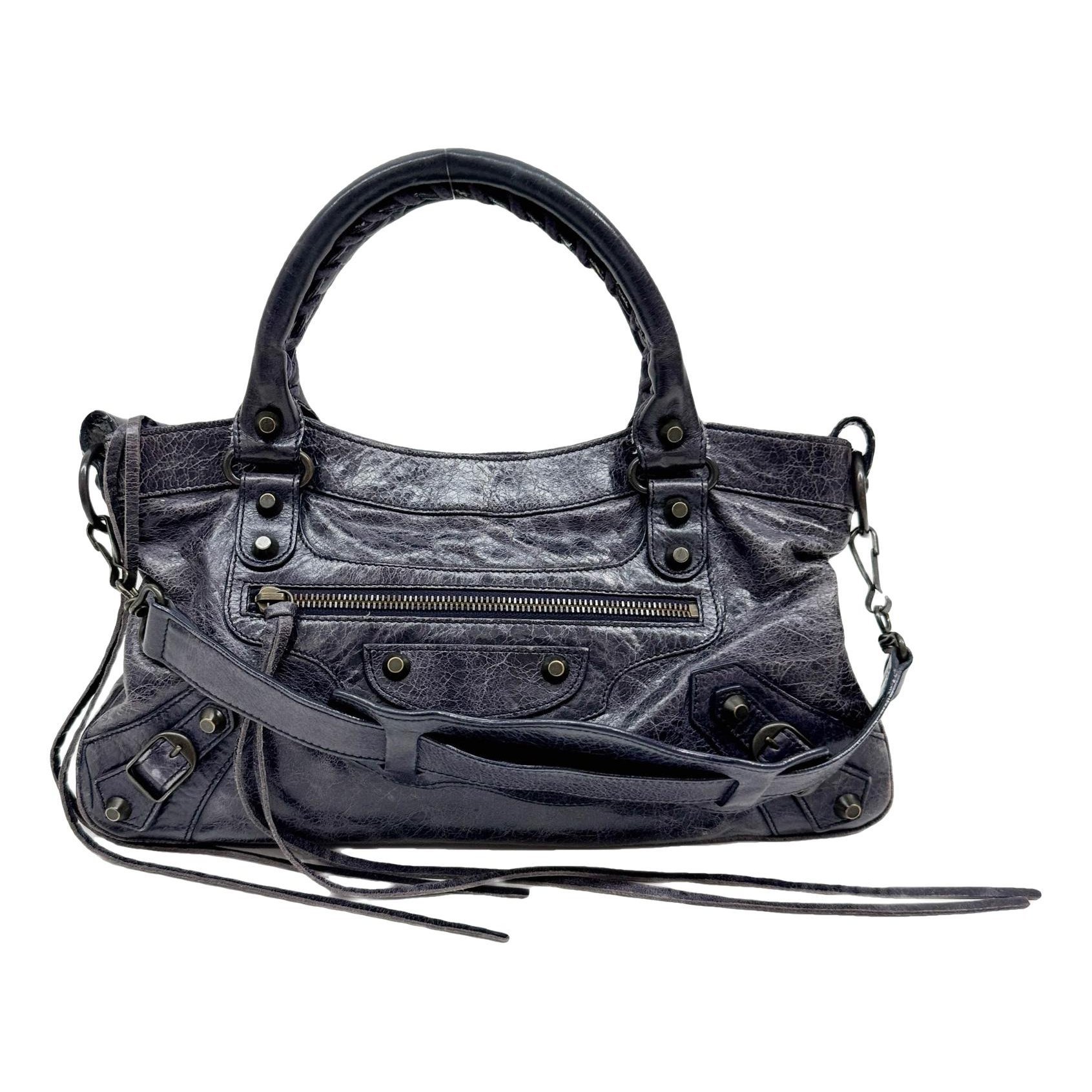 First leather handbag