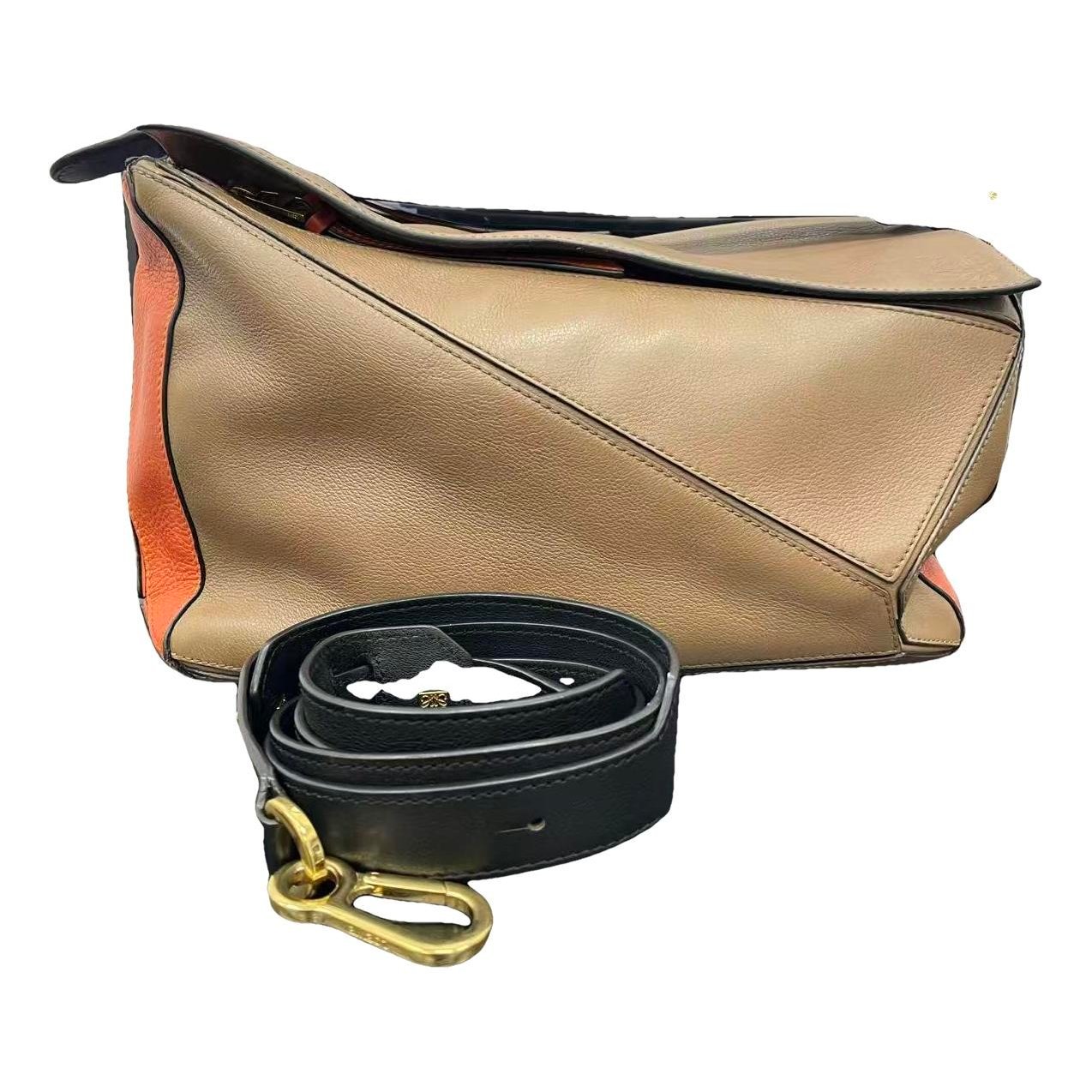 Puzzle leather handbag