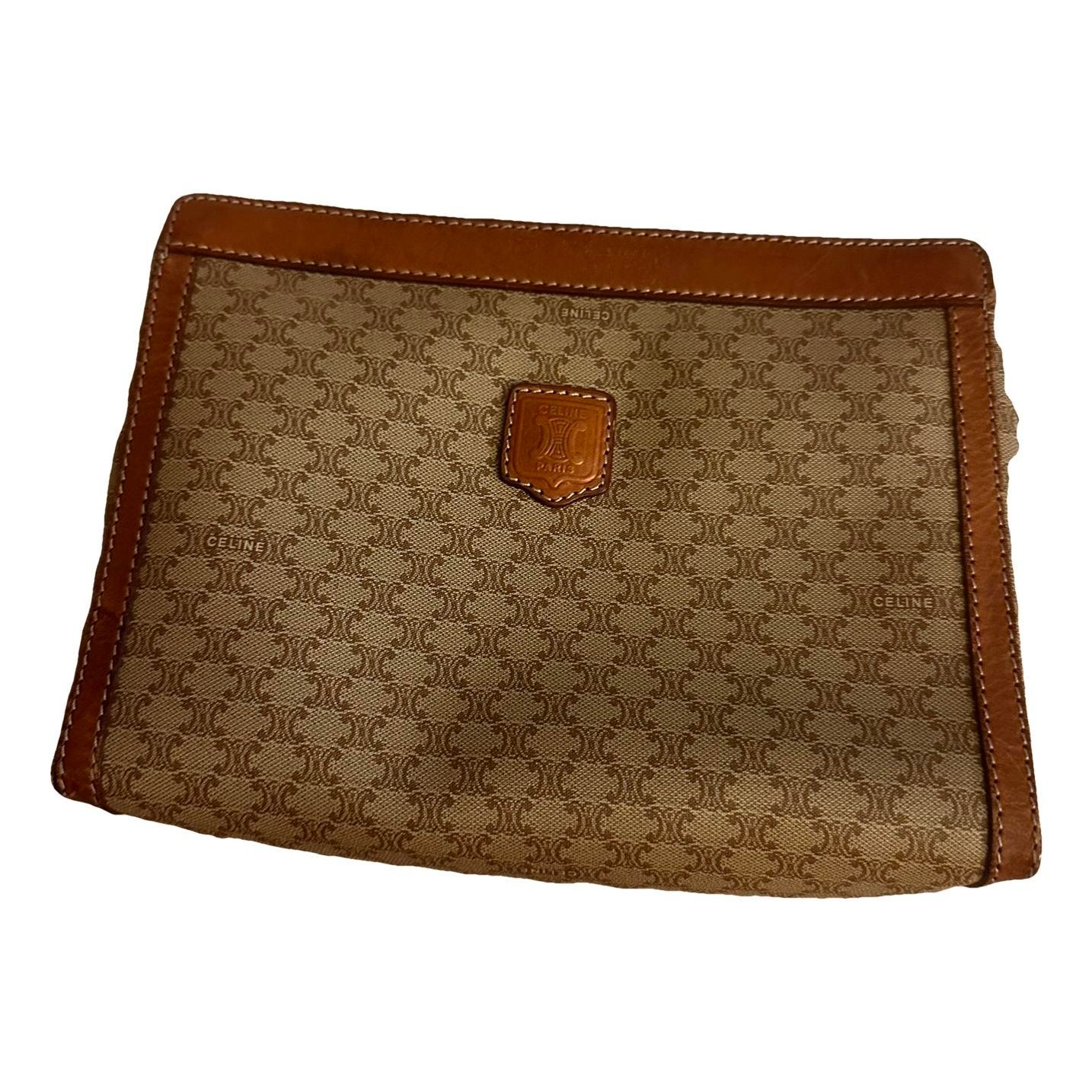 Triomphe Vintage leather clutch bag