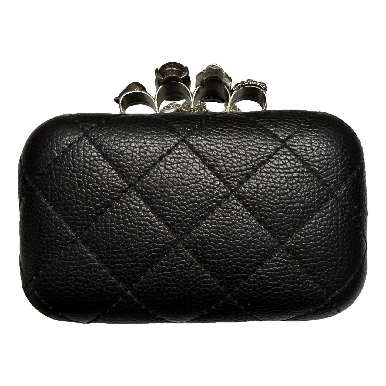Knuckle leather clutch bag