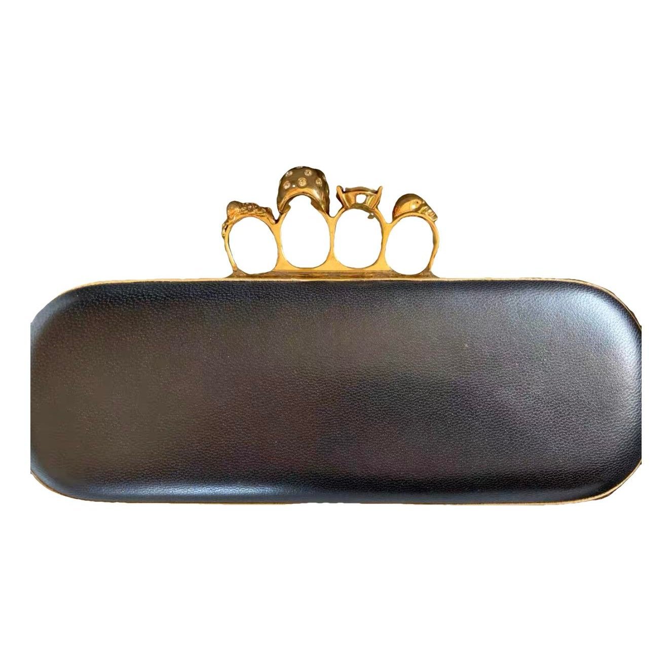 Knuckle leather clutch bag