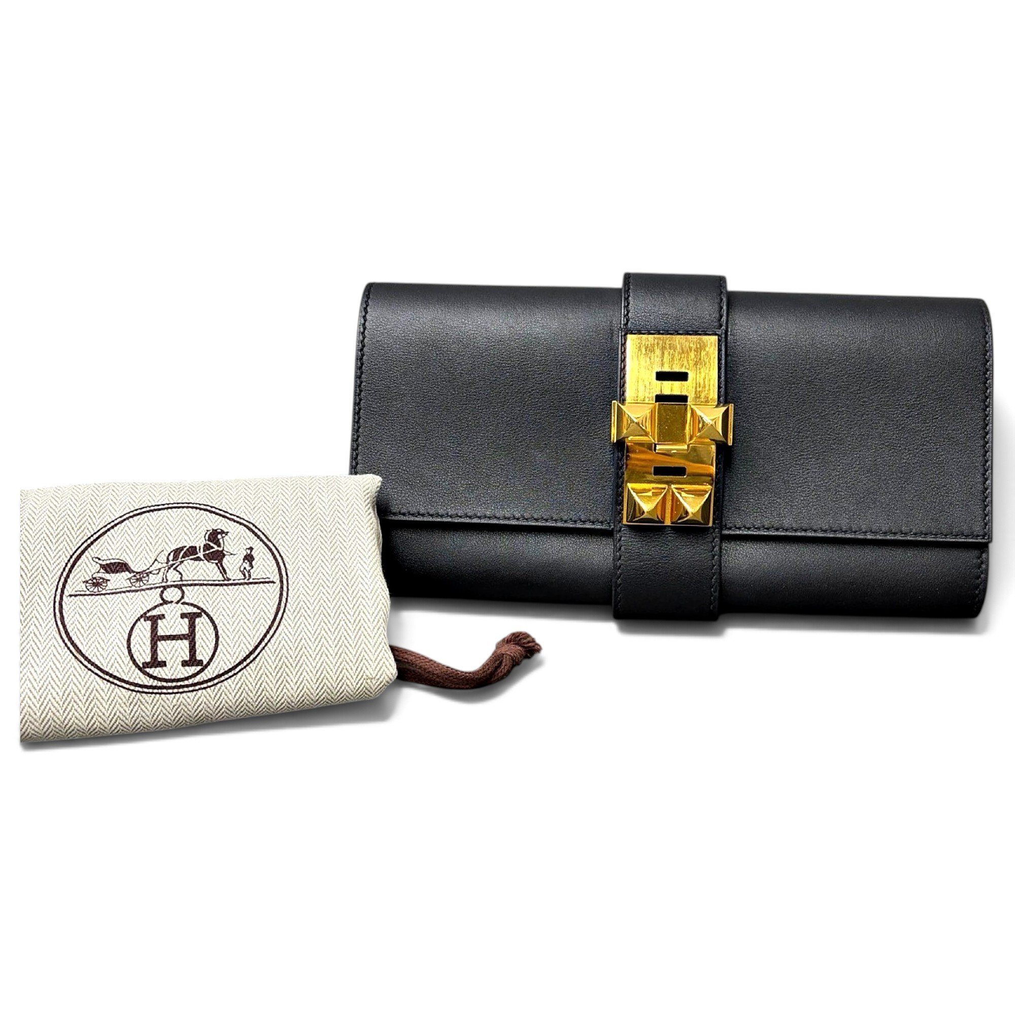 Médor leather clutch bag