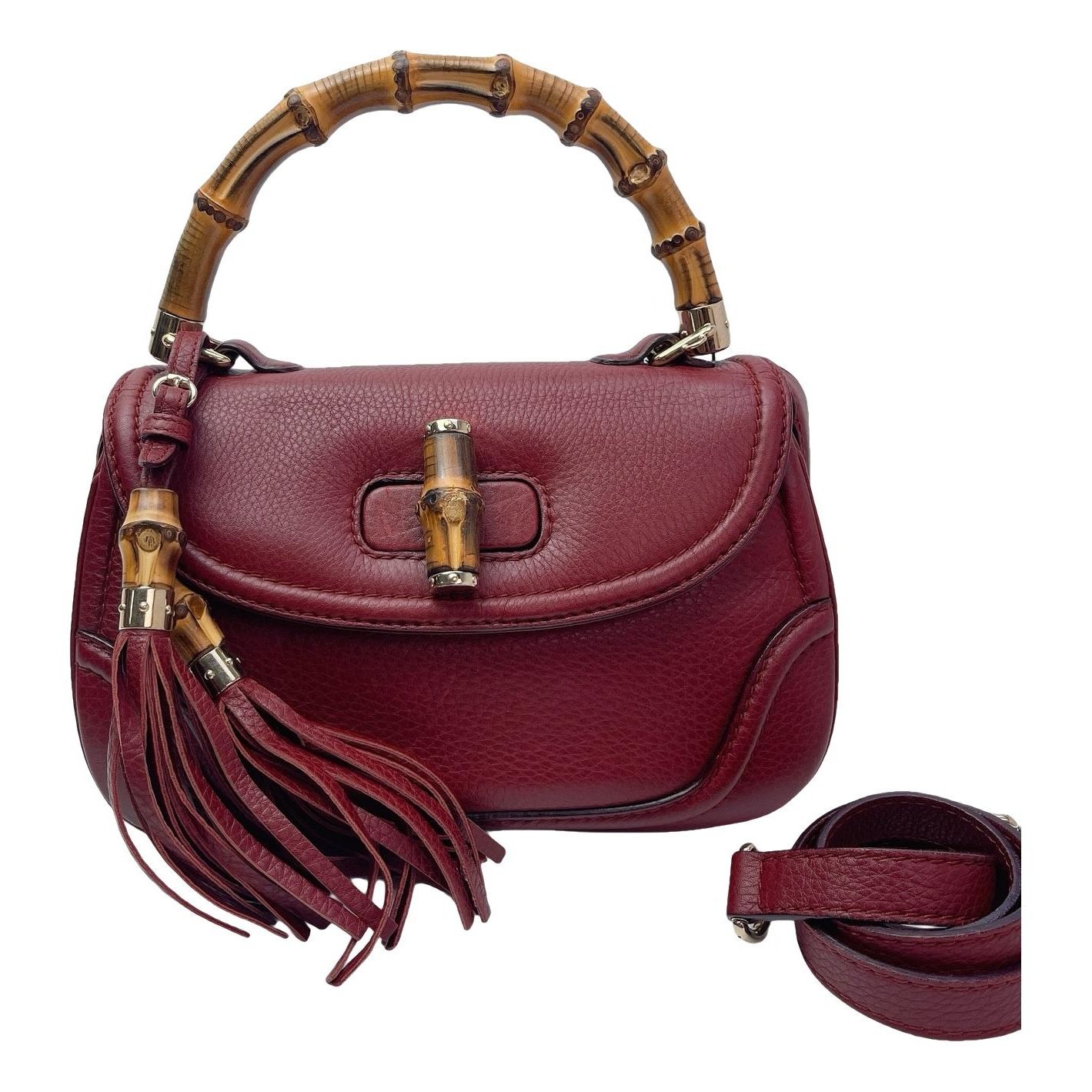 Convertible Pompon Bamboo Top Handle leather handbag