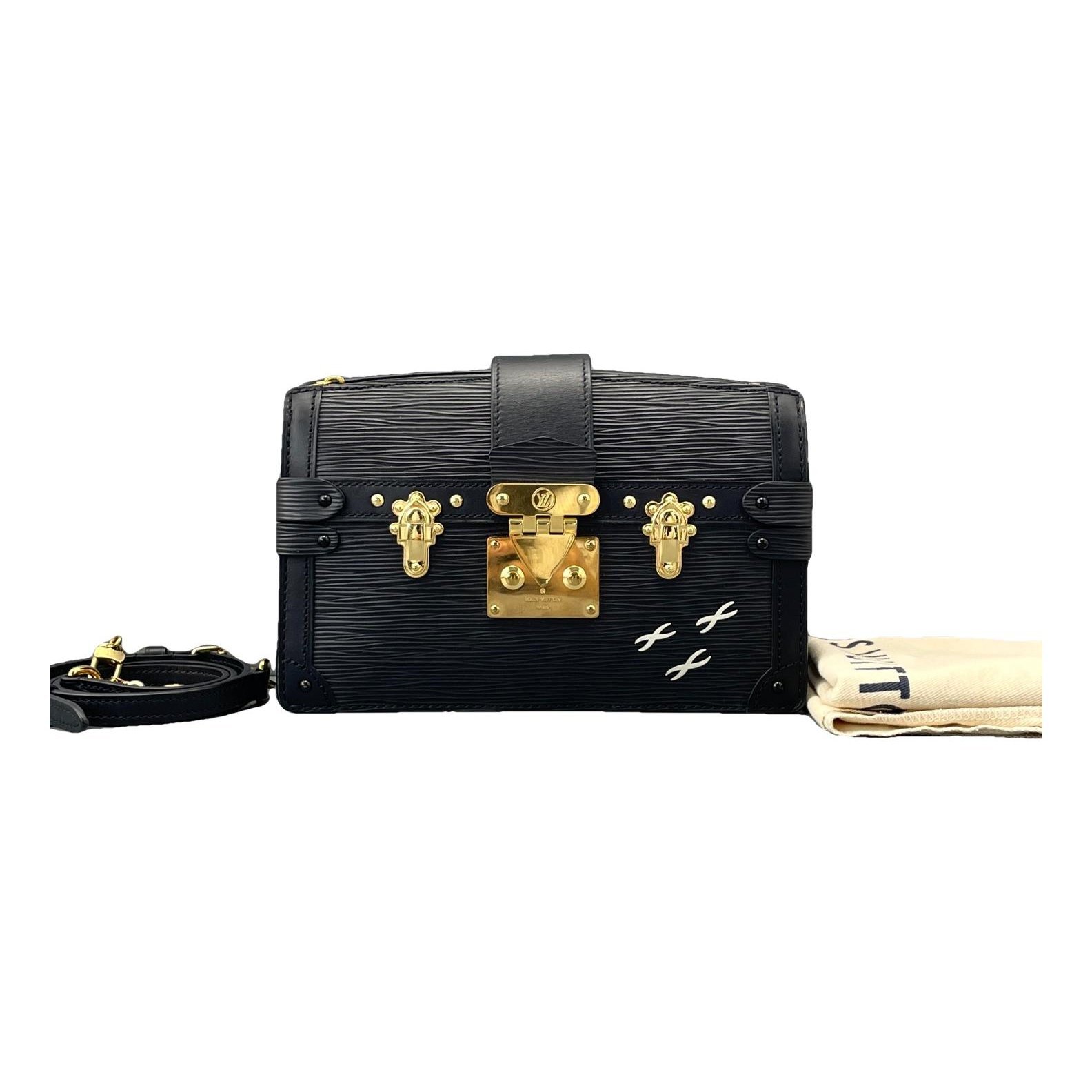 Pochette Trunk leather handbag