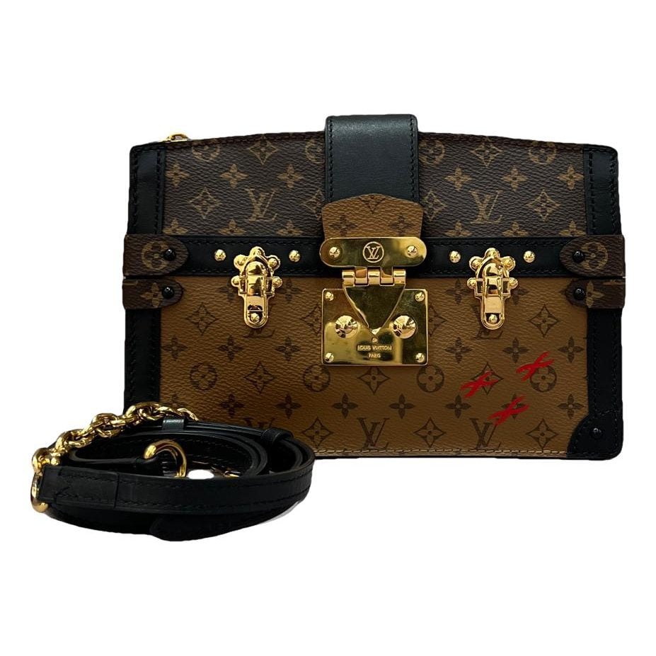 Pochette Trunk leather handbag