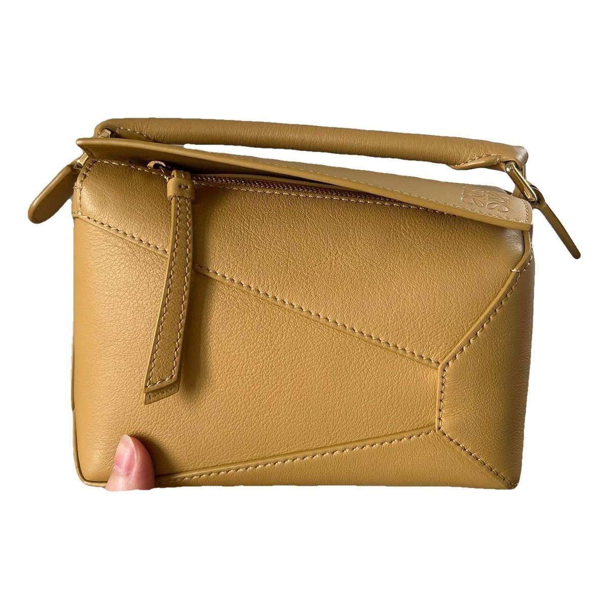 Puzzle leather handbag