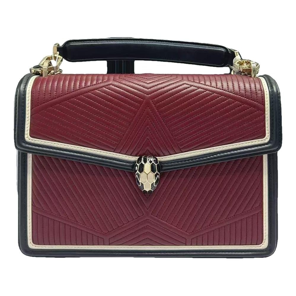 Serpenti leather handbag