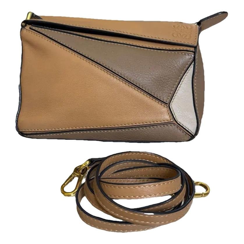 Puzzle leather crossbody bag