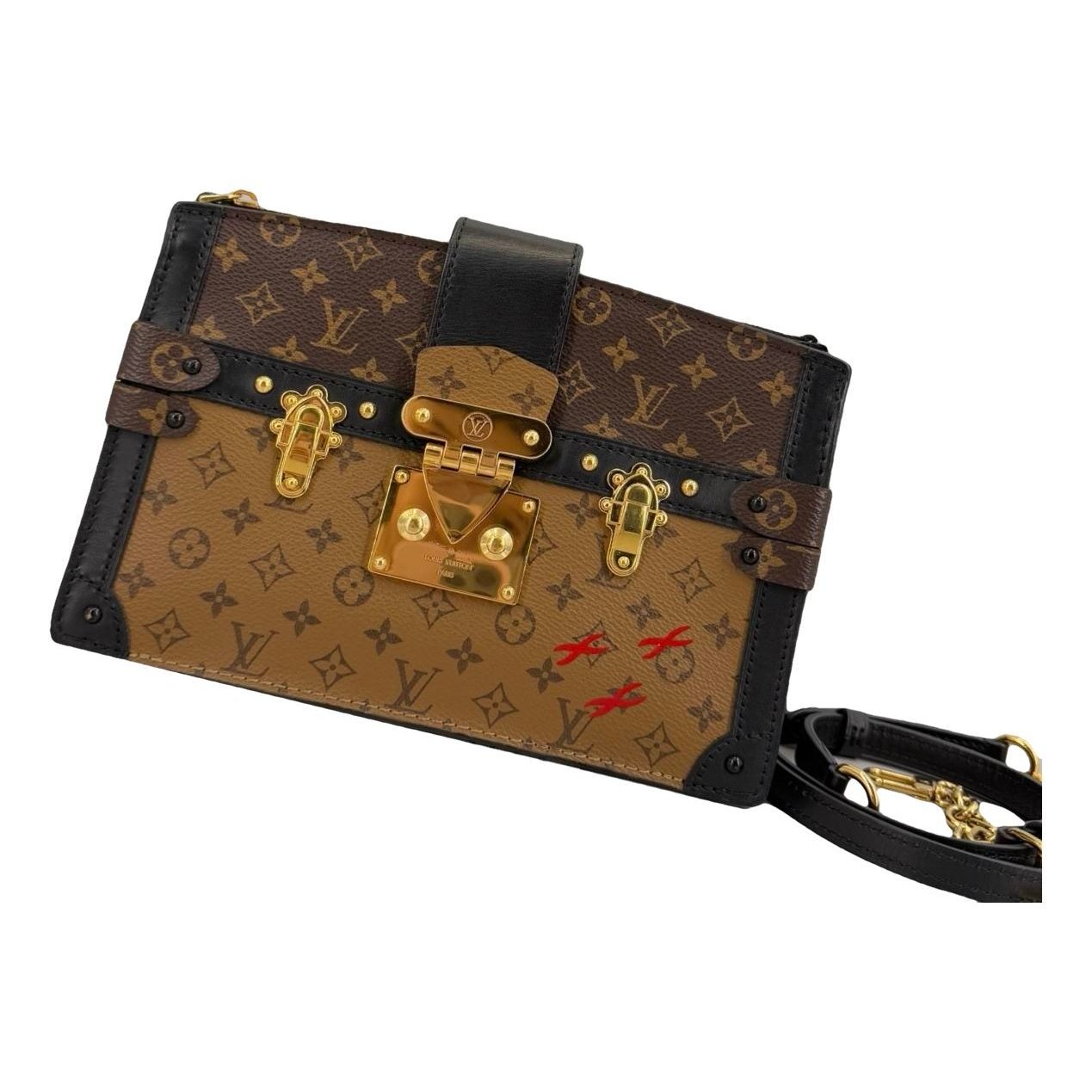 Pochette Trunk leather handbag