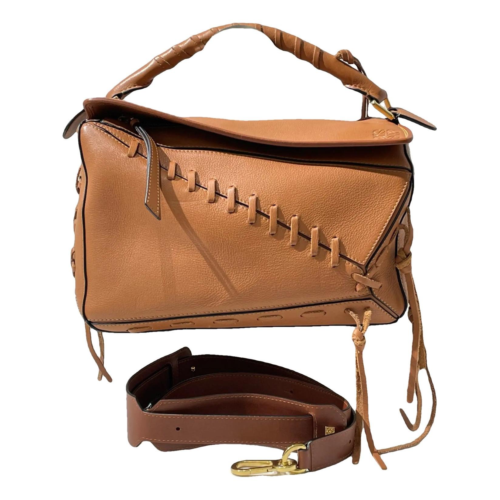 Puzzle leather handbag