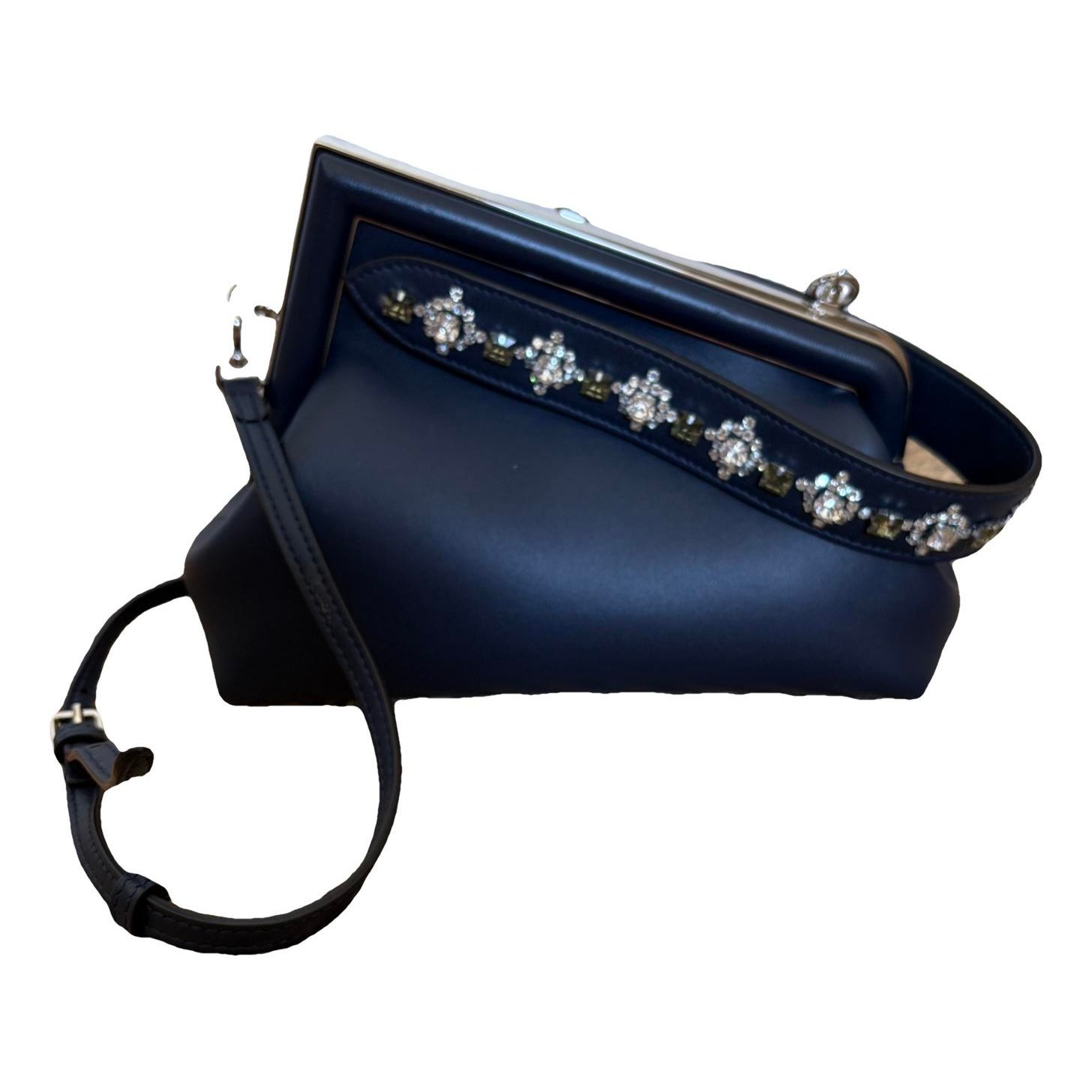 First leather handbag