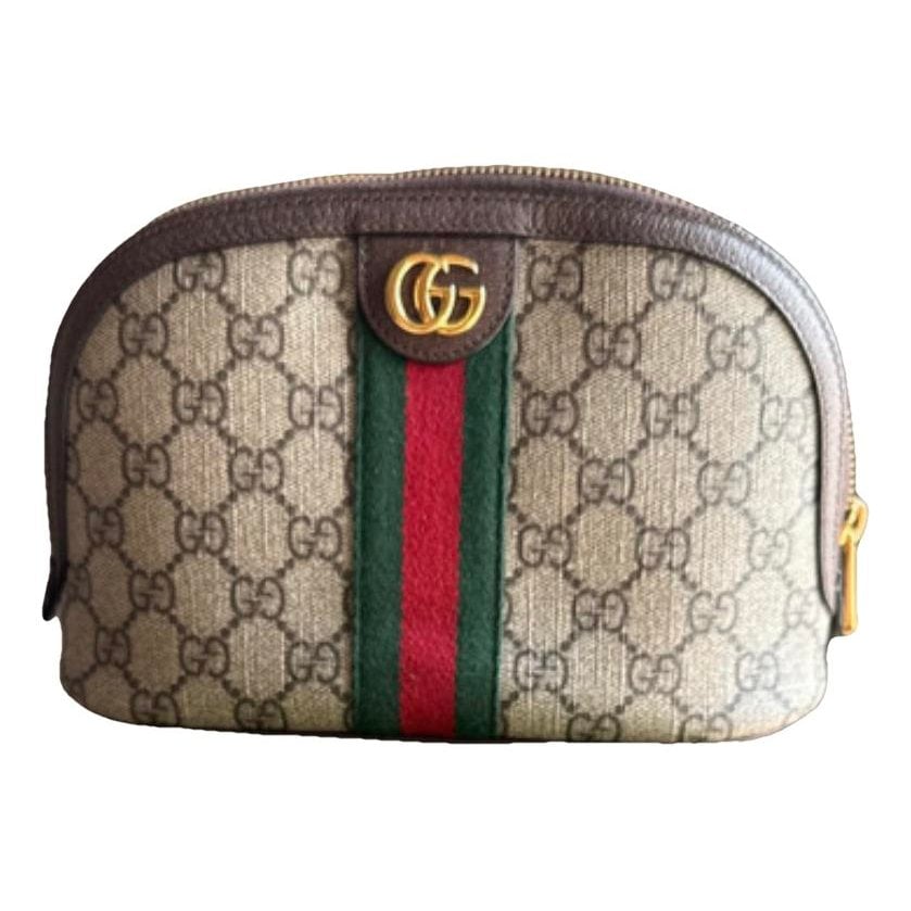 Ophidia leather clutch bag