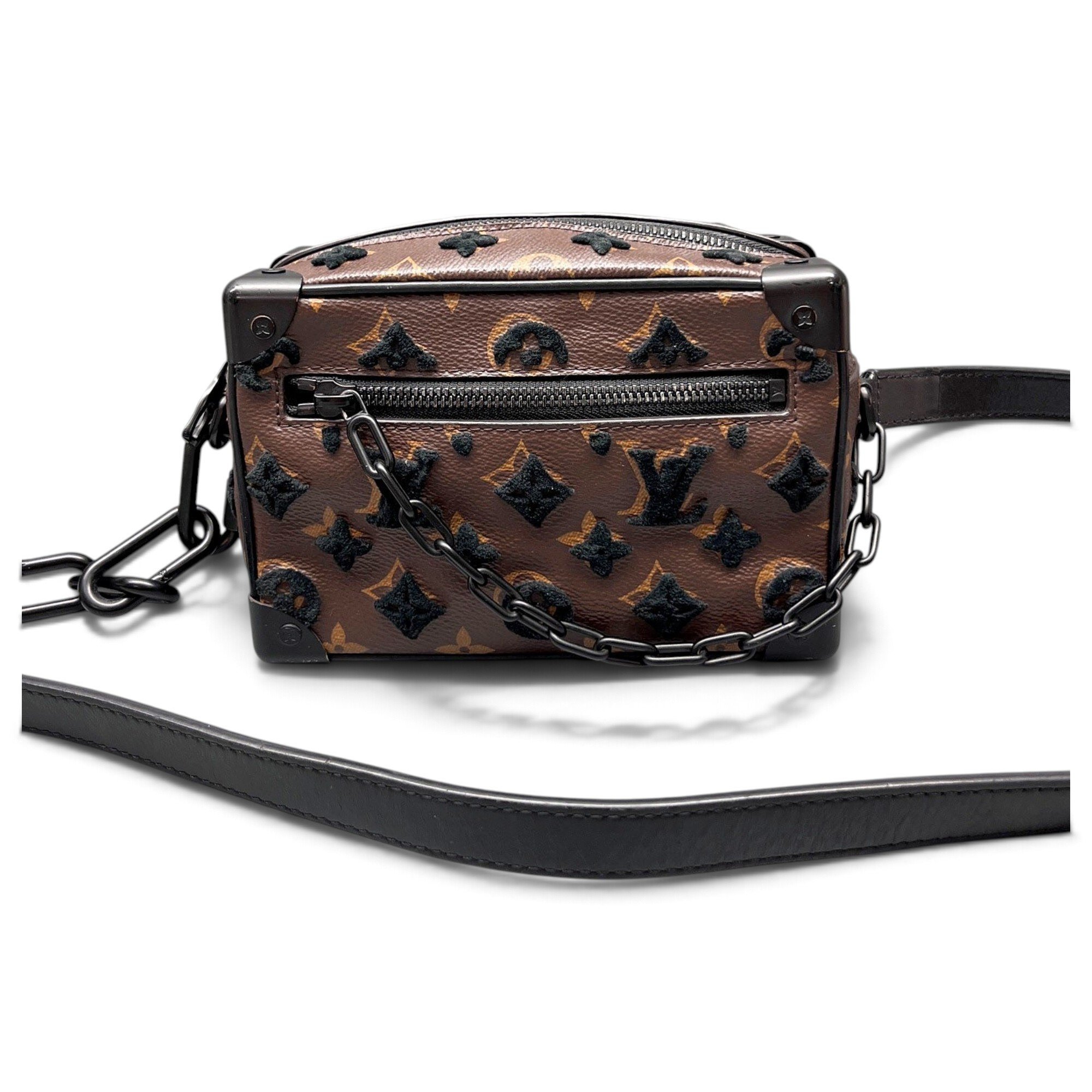 Pochette Trunk leather handbag