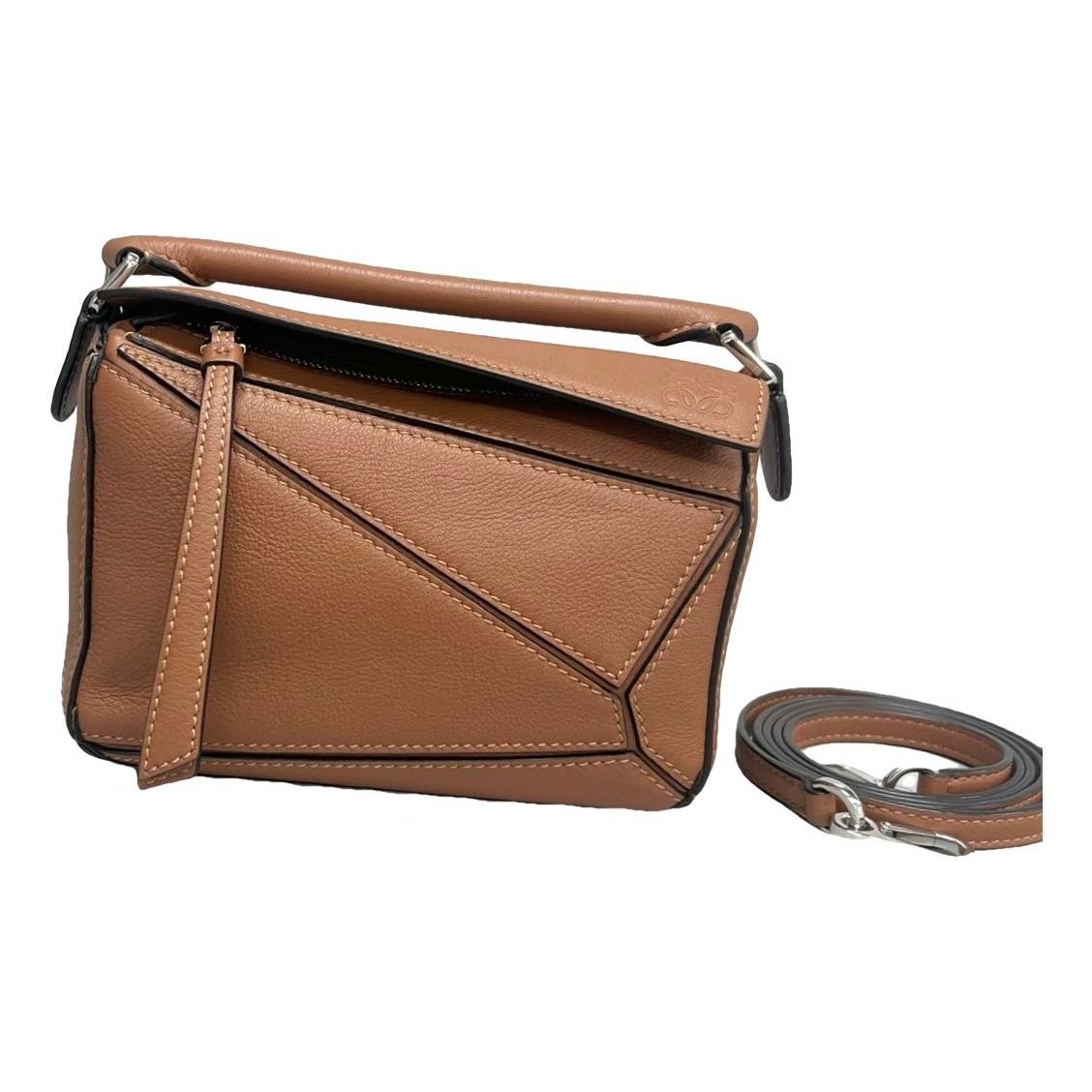 Puzzle leather handbag