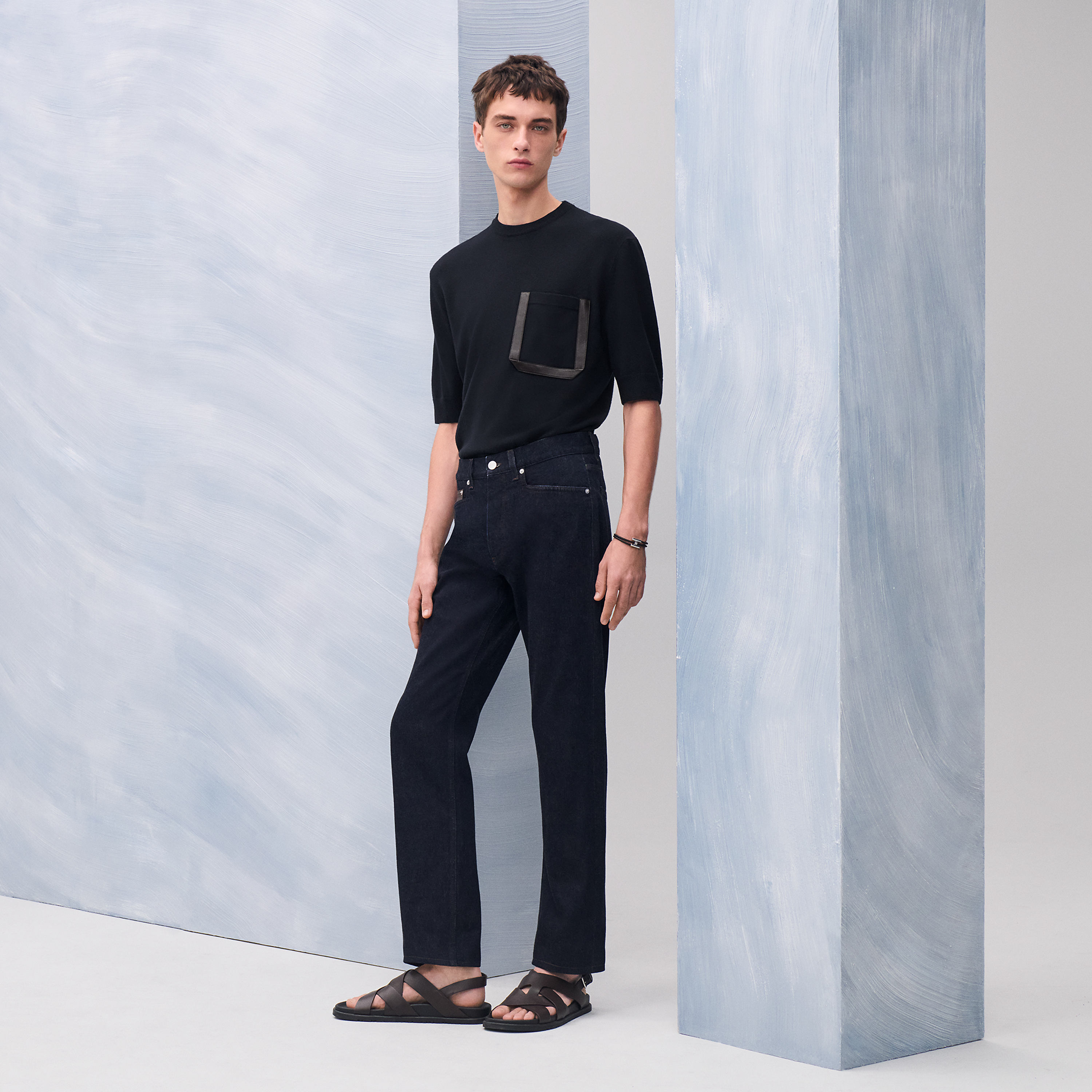 Jeans with leather pocket detail