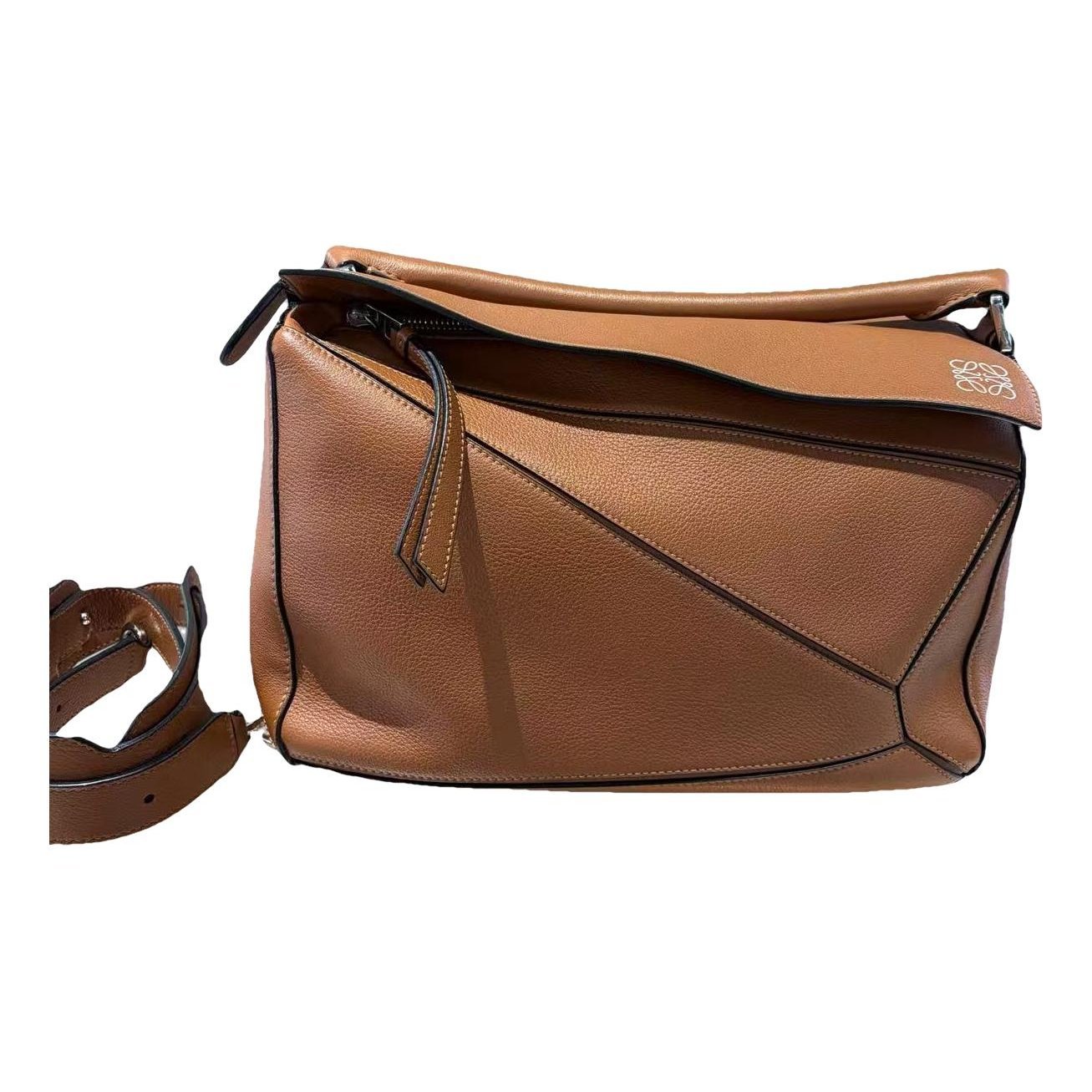 Puzzle leather handbag