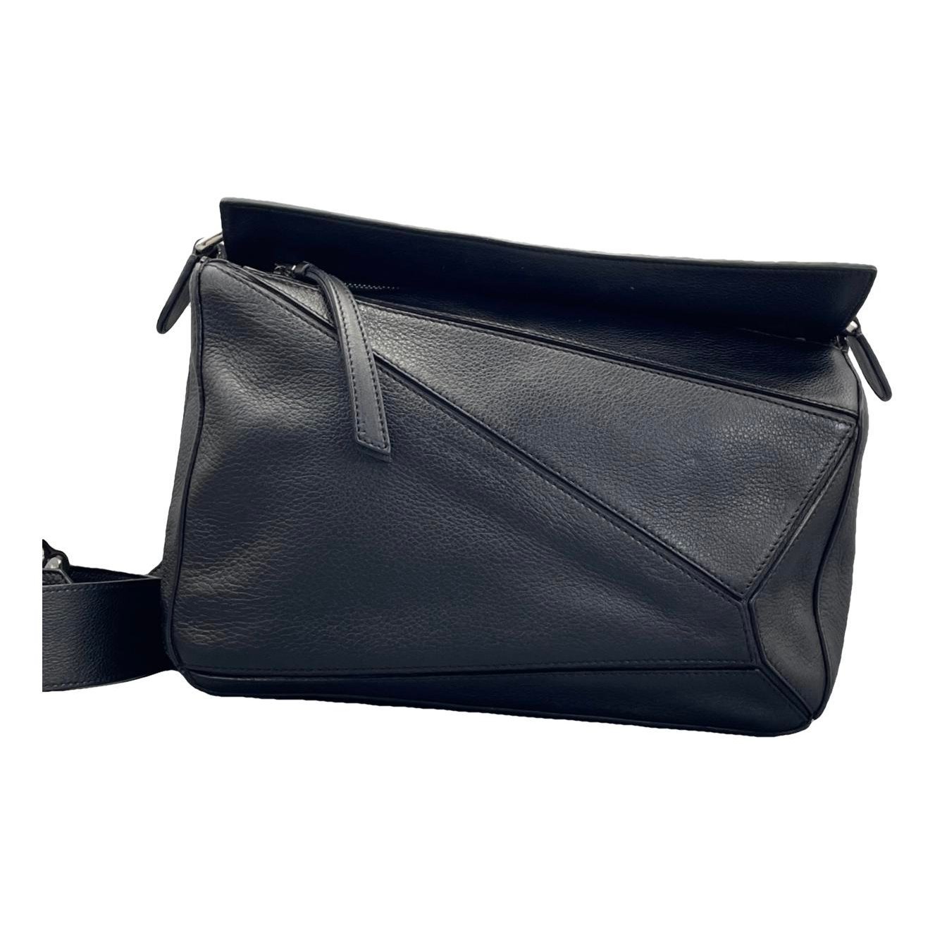 Puzzle leather handbag