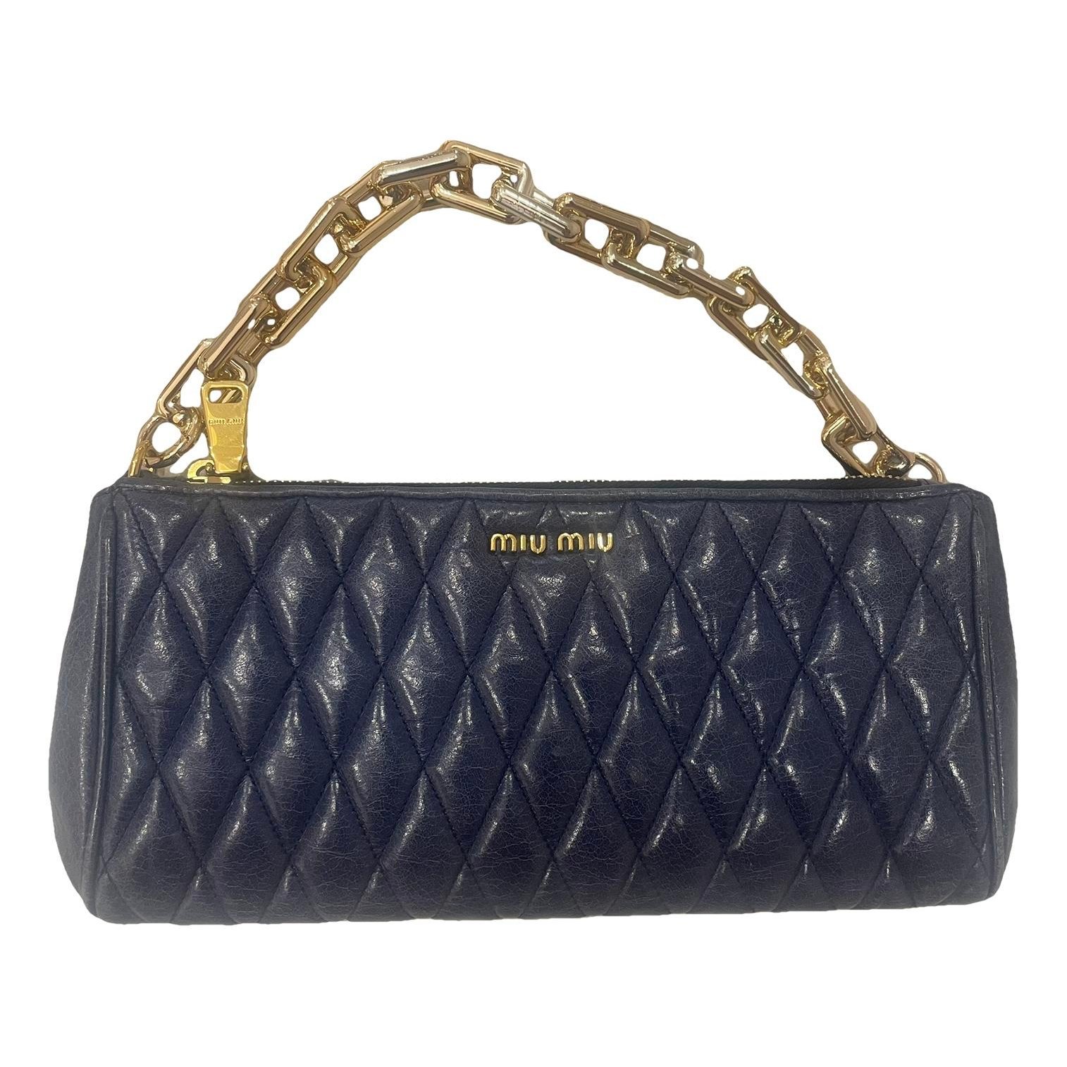 Matelassé leather clutch bag