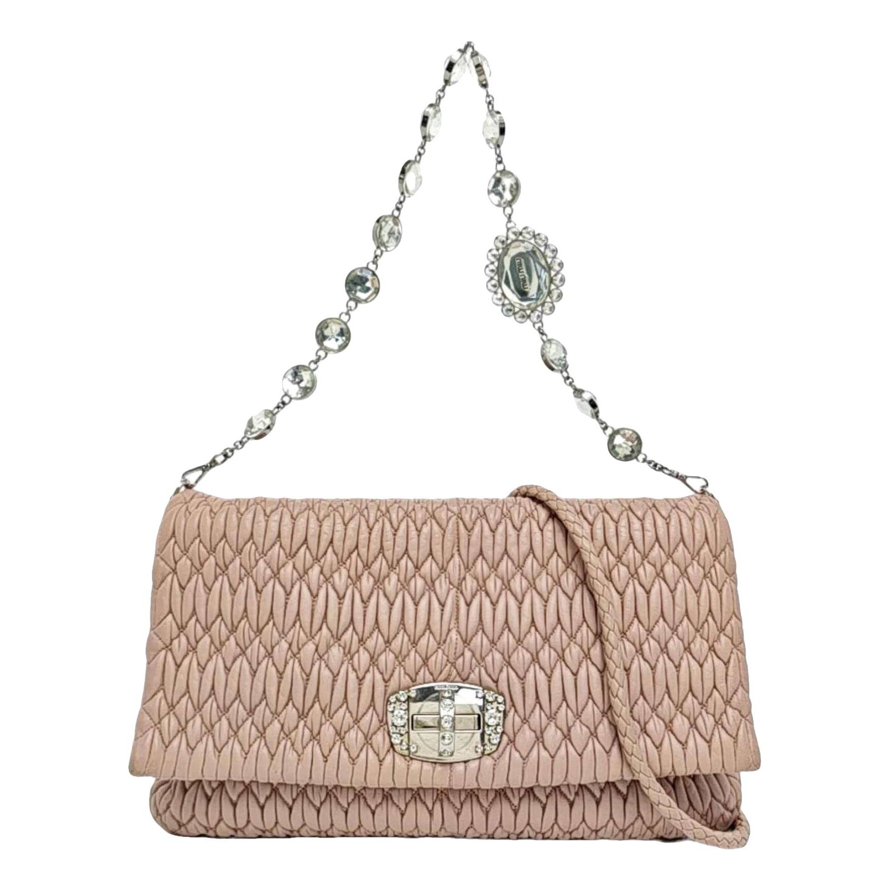Miu Crystal leather clutch bag