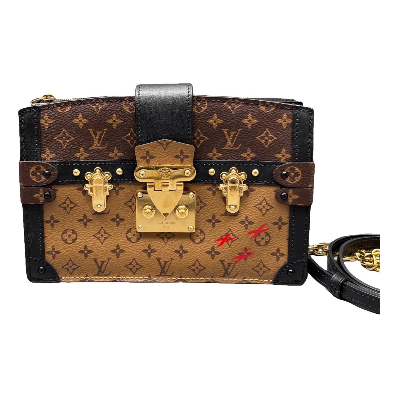 Pochette Trunk leather handbag