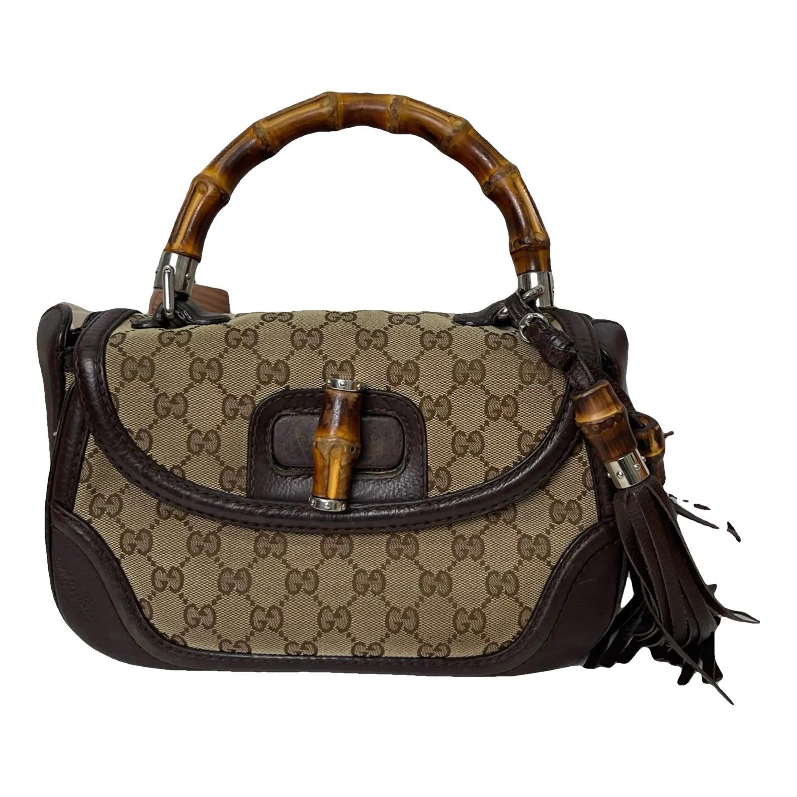 Convertible Pompon Bamboo Top Handle leather handbag