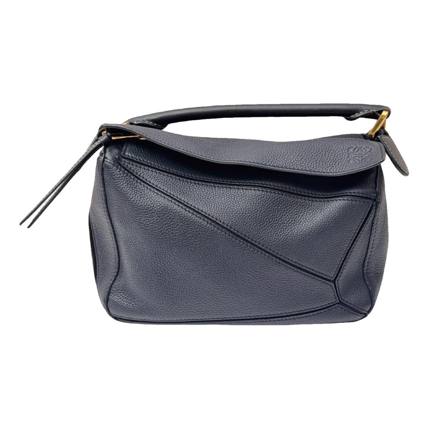 Puzzle leather handbag