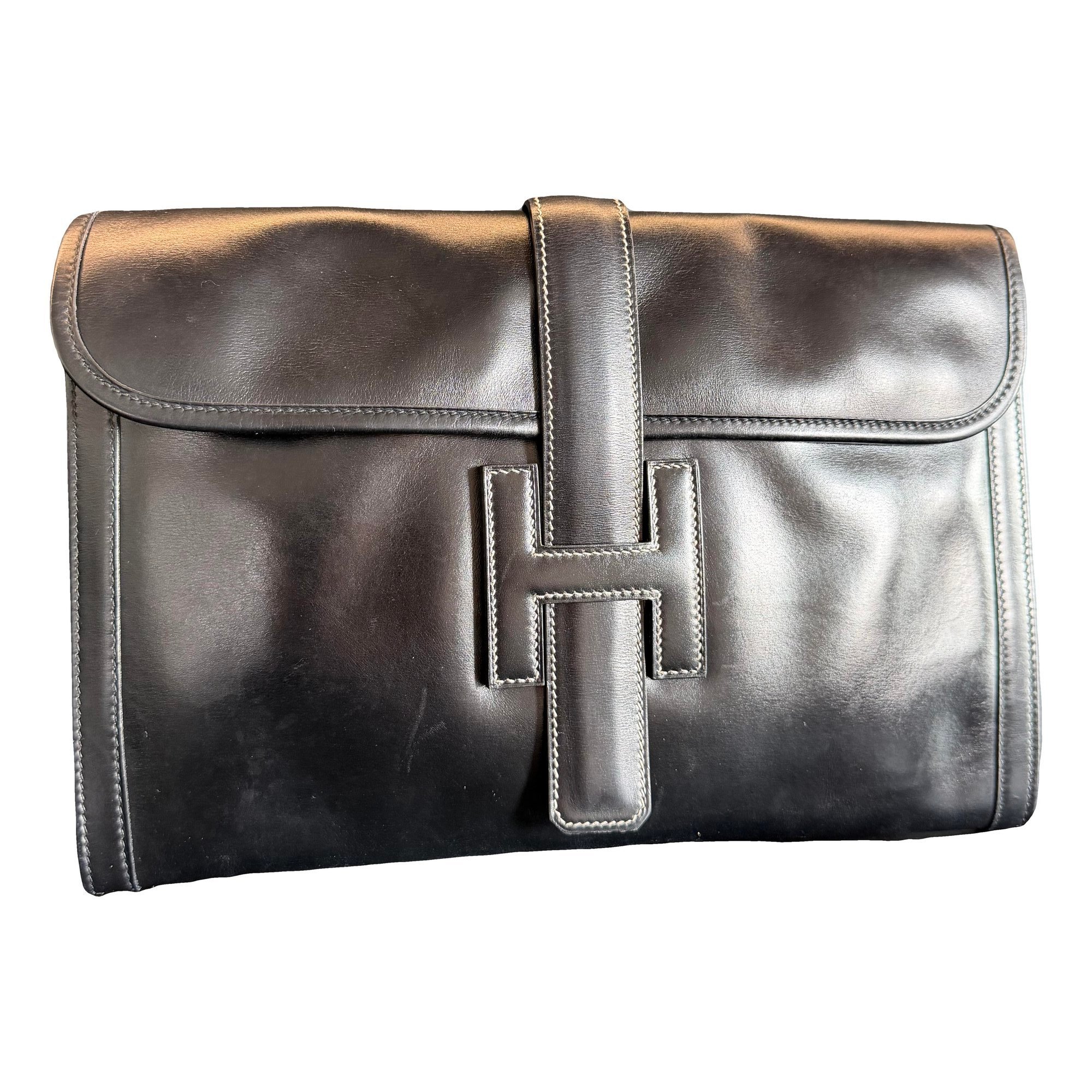 Jige leather clutch bag