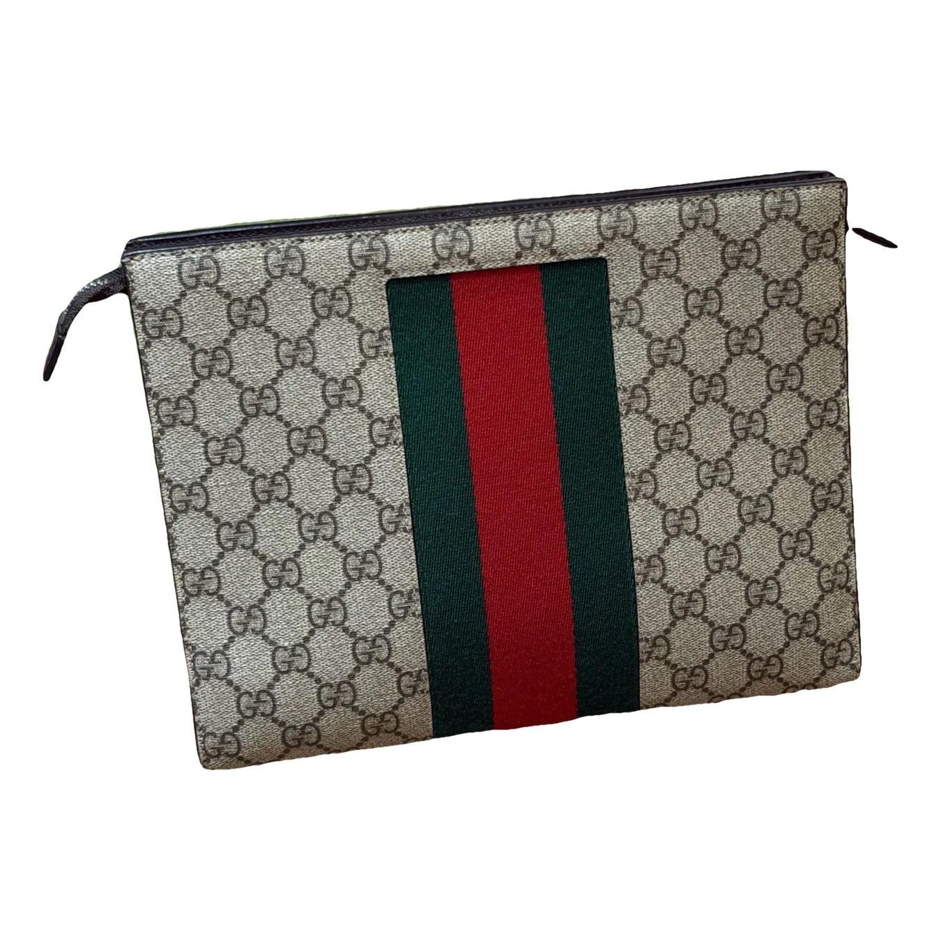 Ophidia vinyl clutch bag