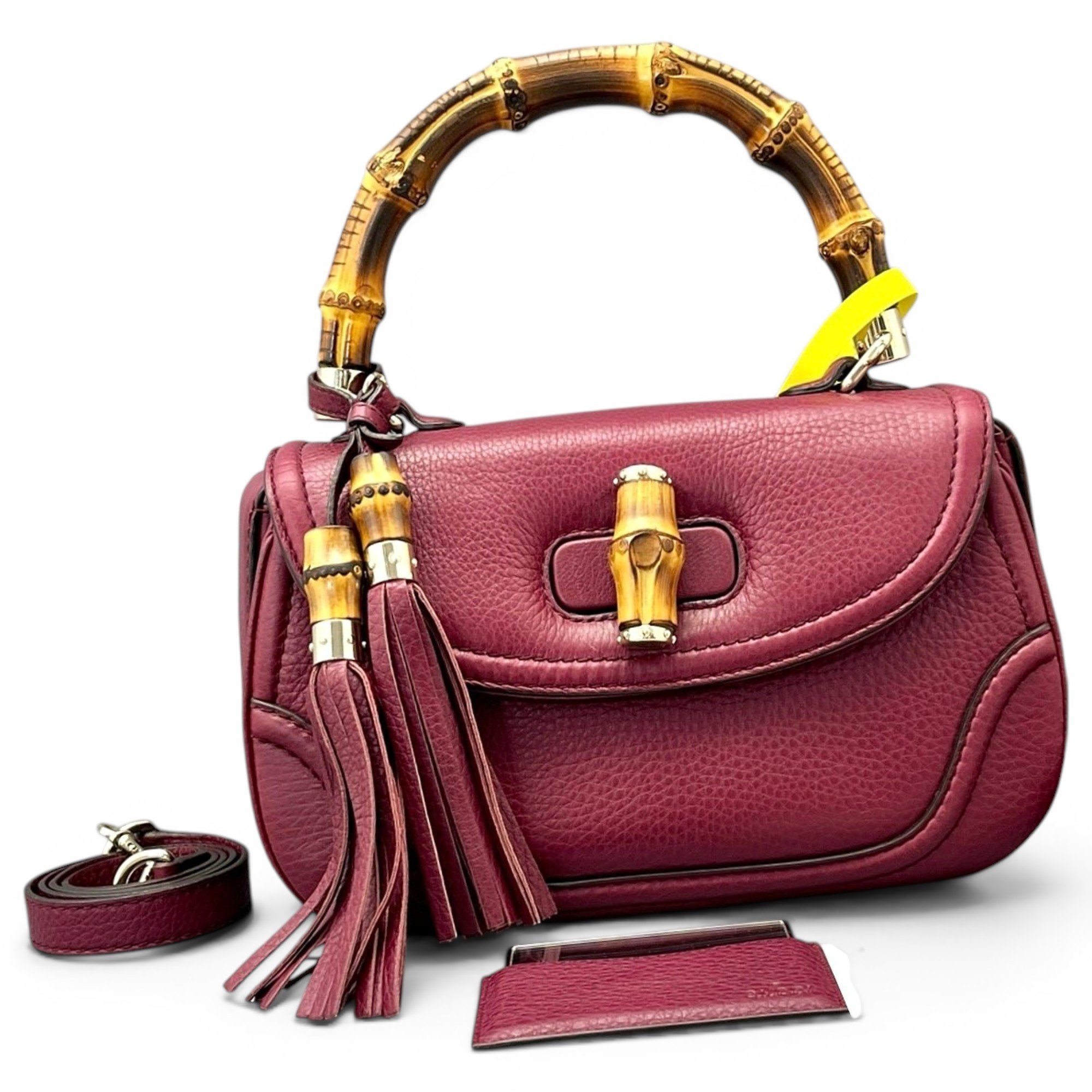Convertible Pompon Bamboo Top Handle leather handbag