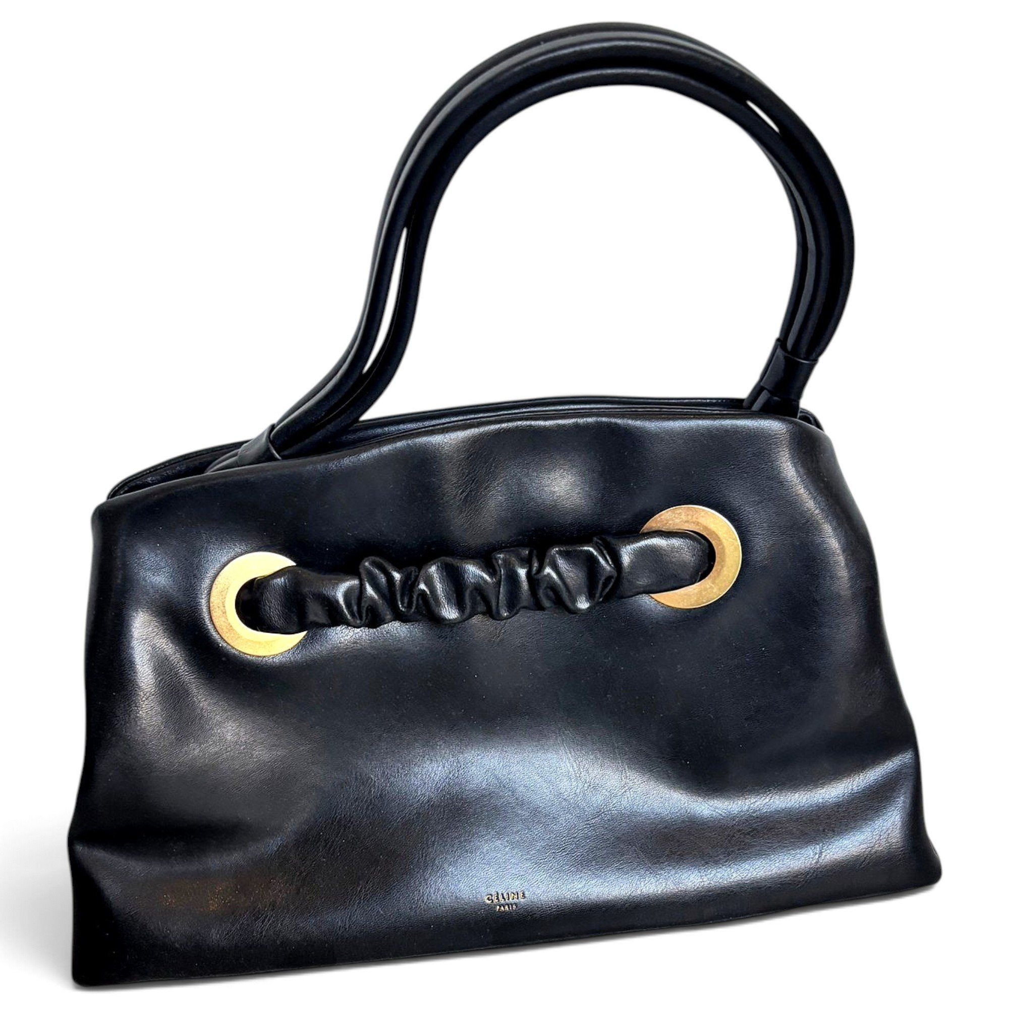 Eyelet leather handbag