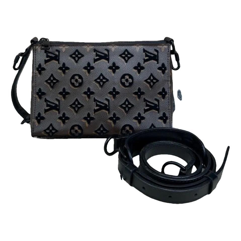 Triangle vinyl crossbody bag