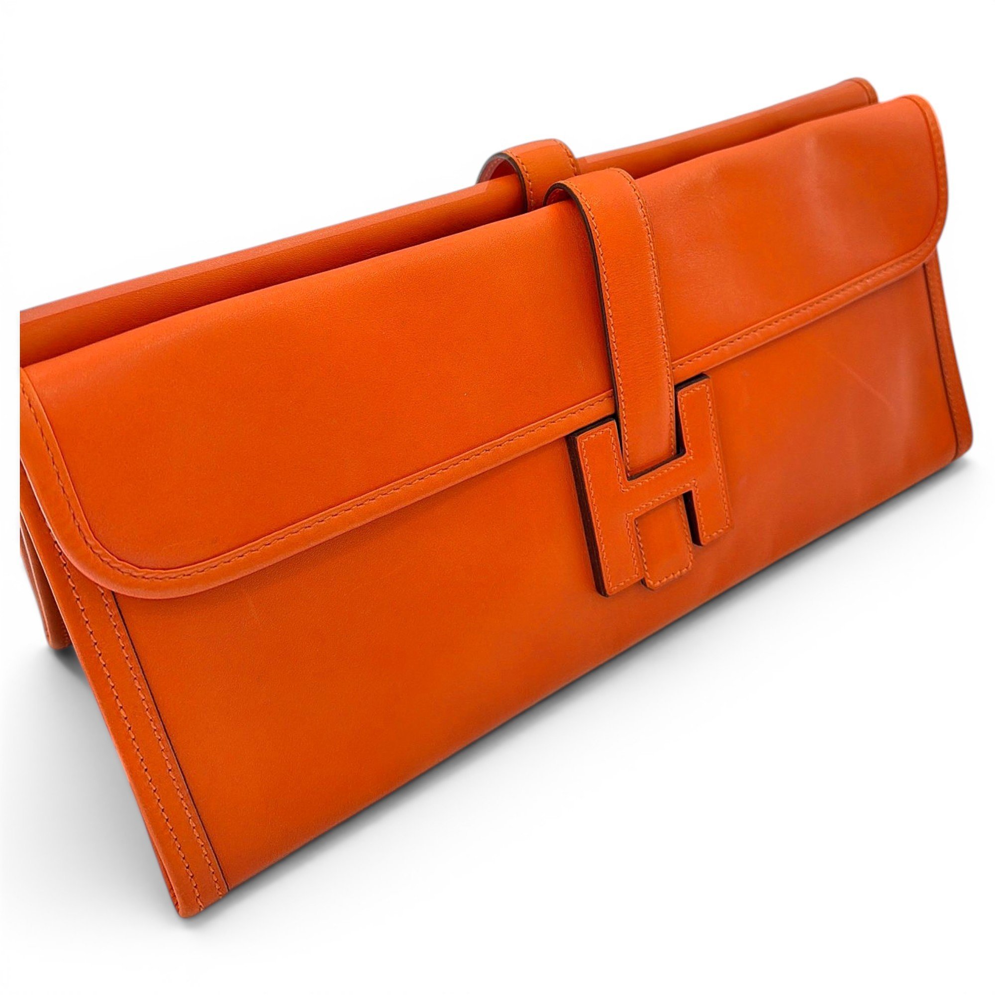 Jige leather clutch bag