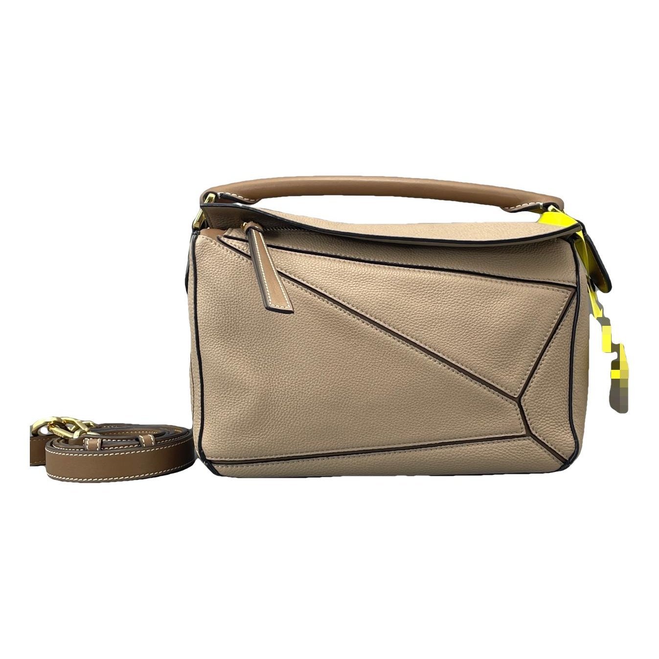 Puzzle leather handbag