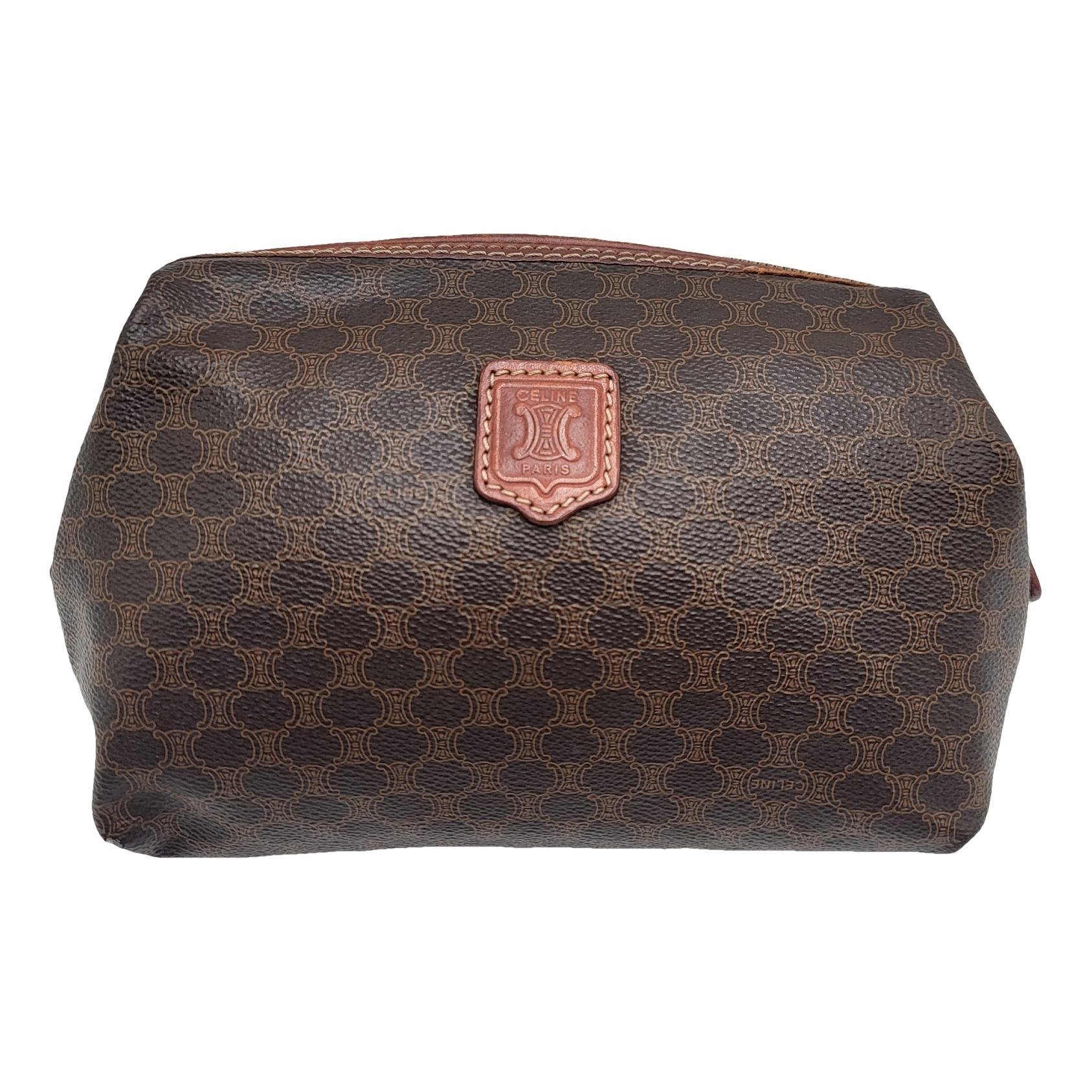 Triomphe Vintage leather clutch bag