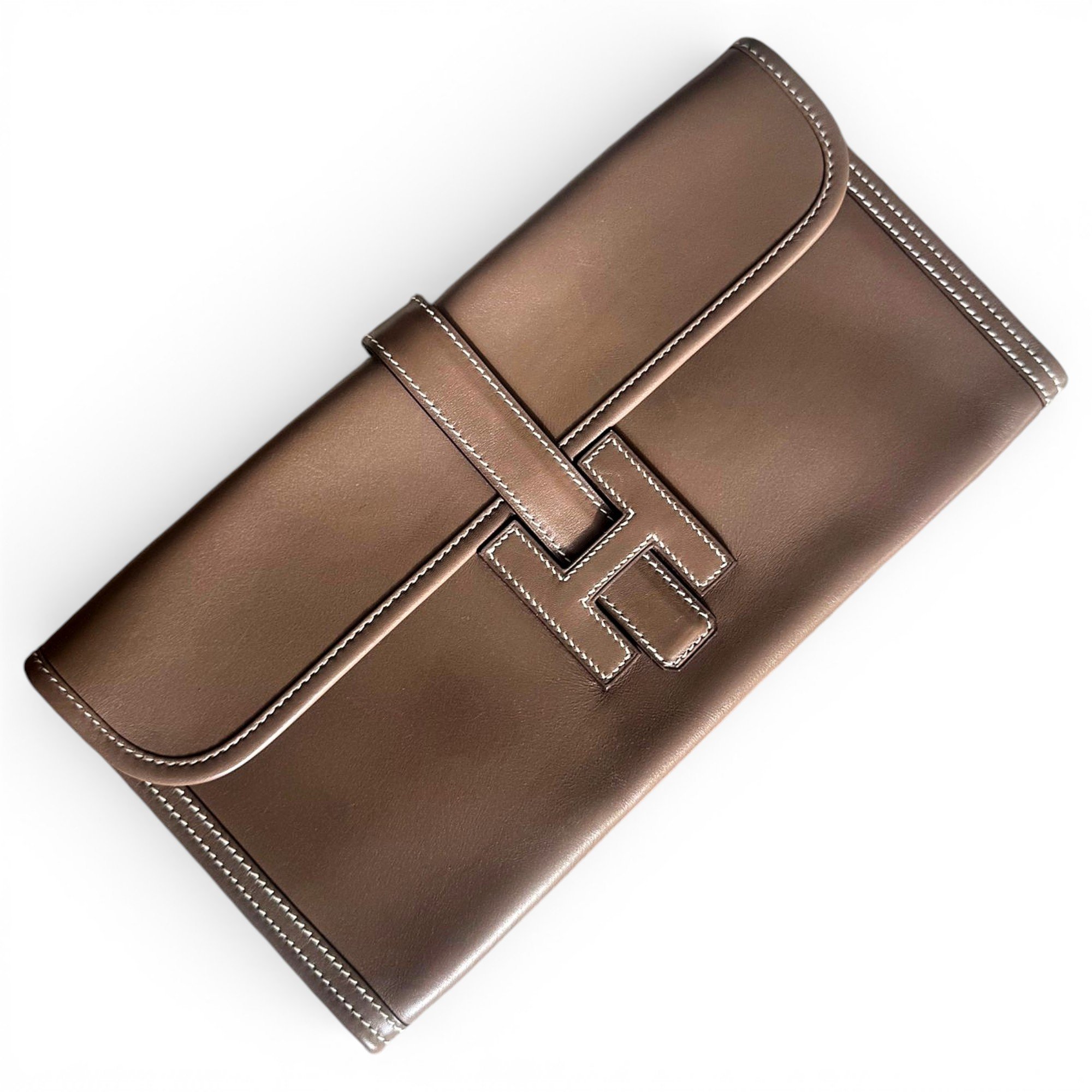 Jige leather clutch bag