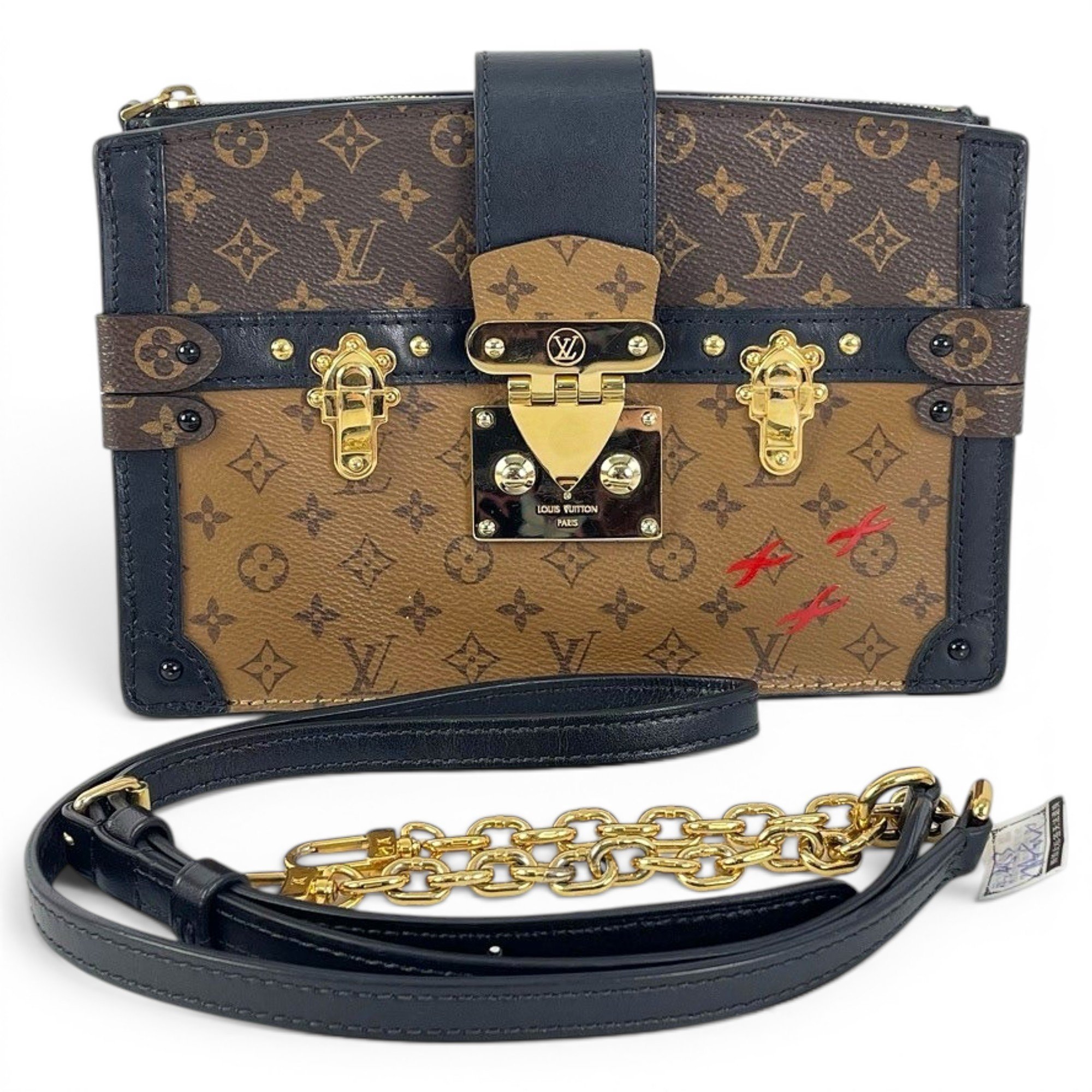Pochette Trunk leather handbag