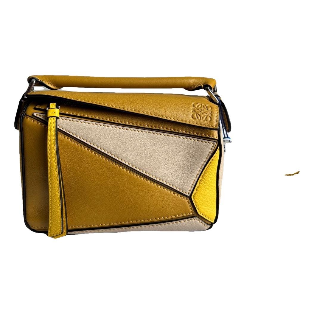Puzzle leather handbag