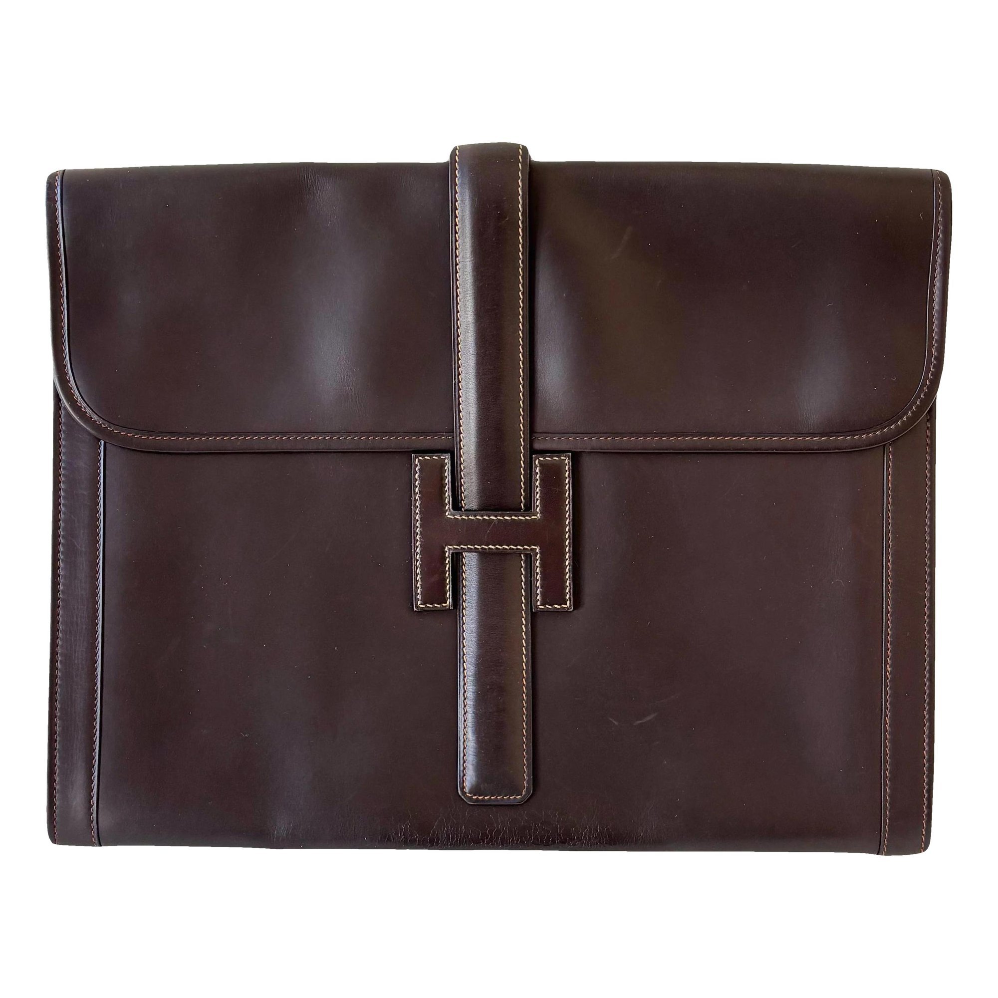 Jige leather clutch bag