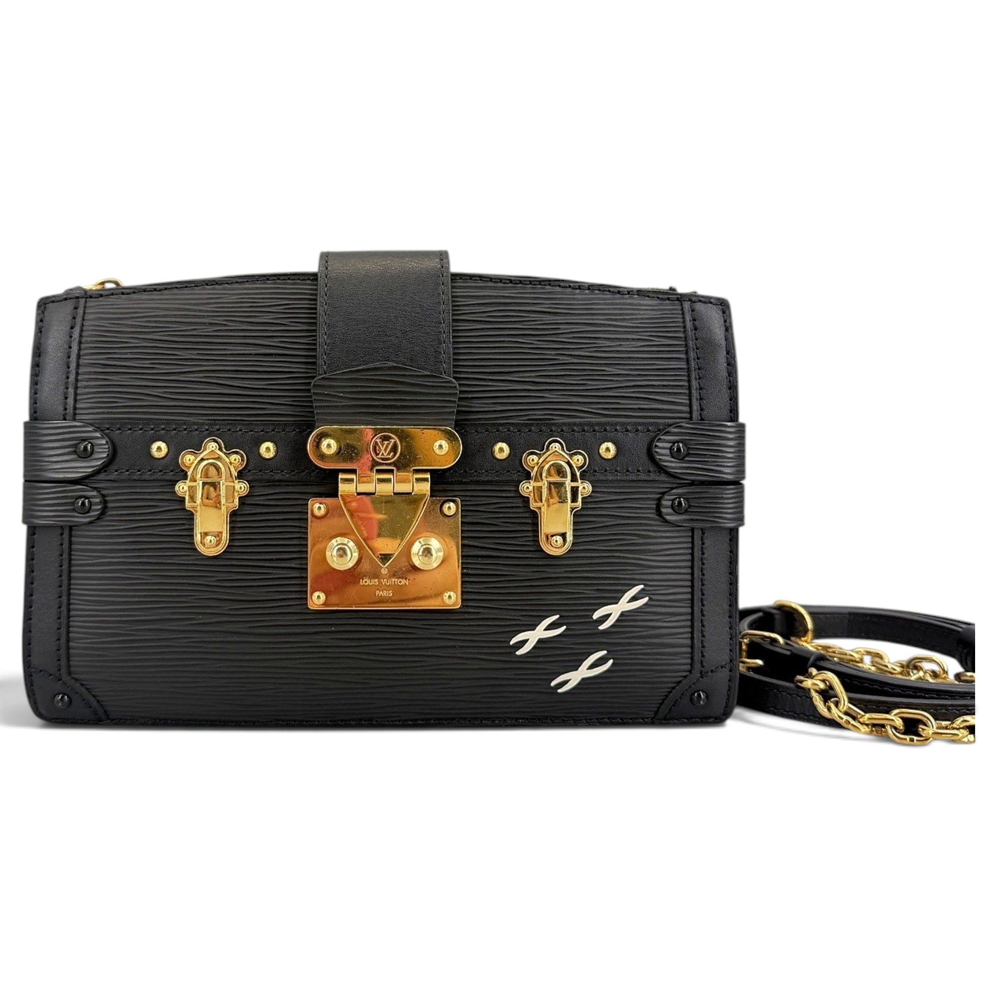 Pochette Trunk leather handbag