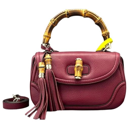 Convertible Pompon Bamboo Top Handle leather handbag