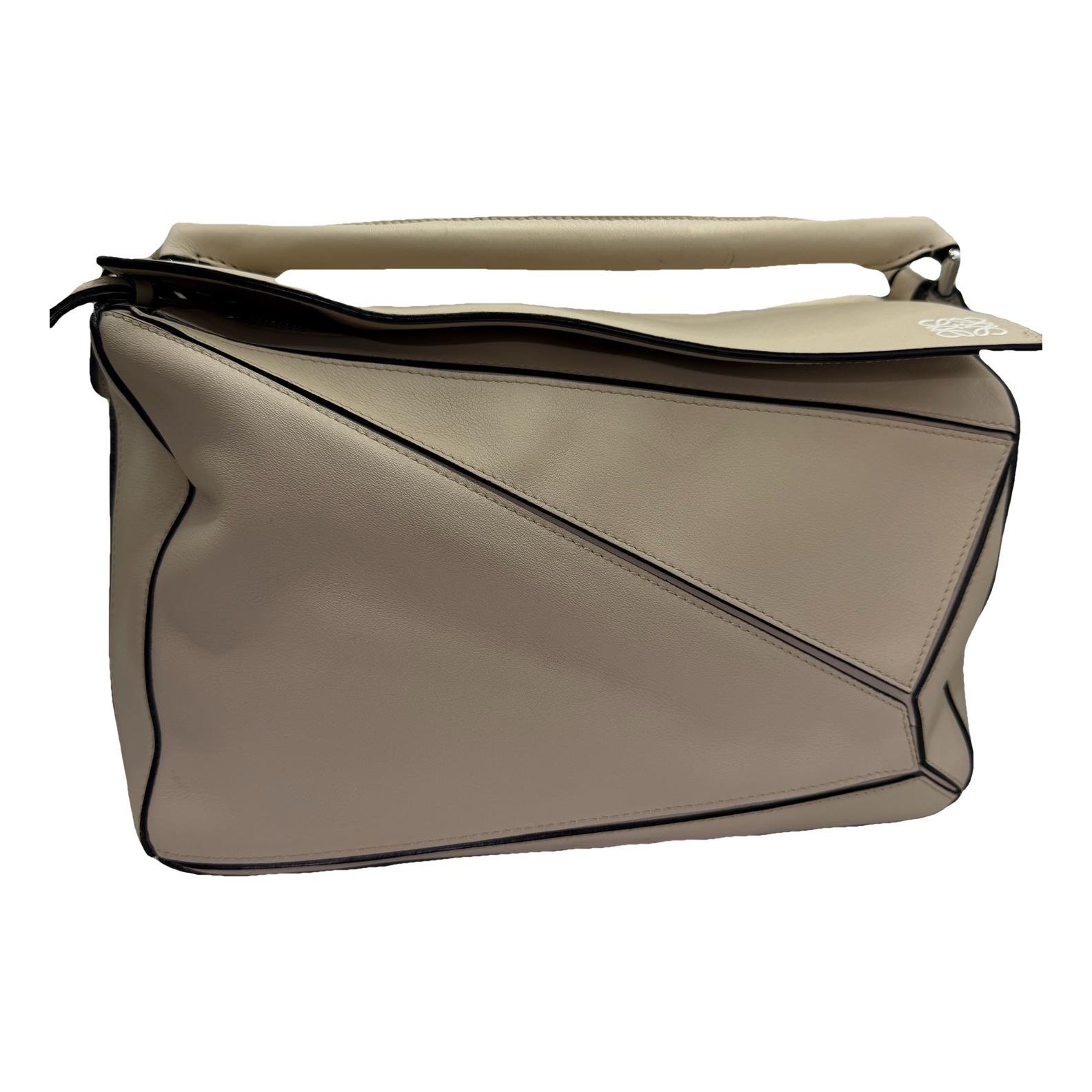 Puzzle leather handbag