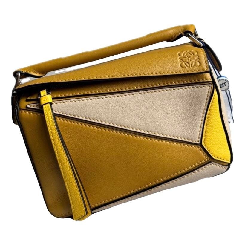 Puzzle leather handbag