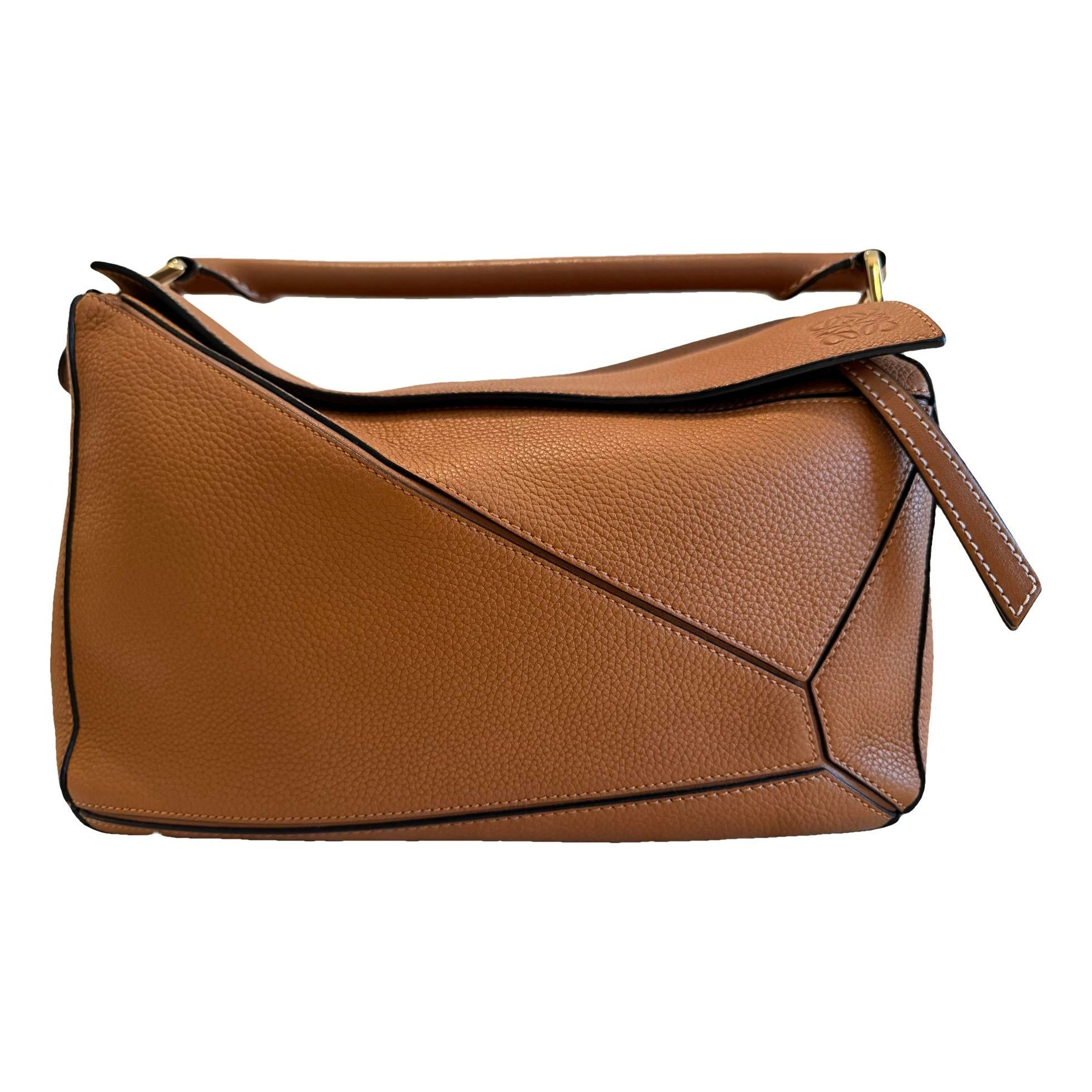 Puzzle leather handbag