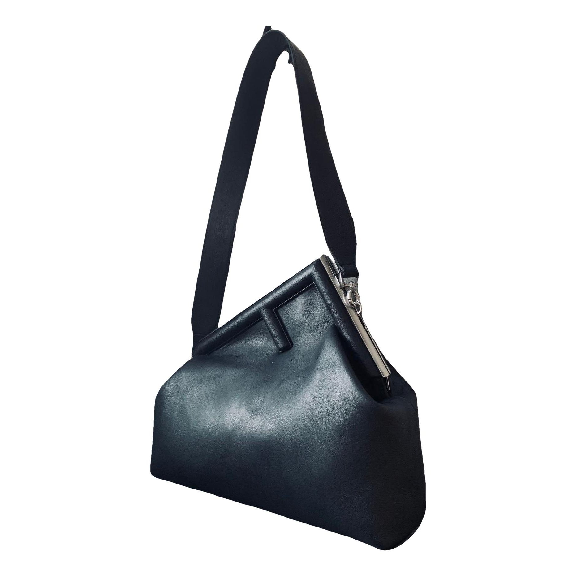 First leather handbag