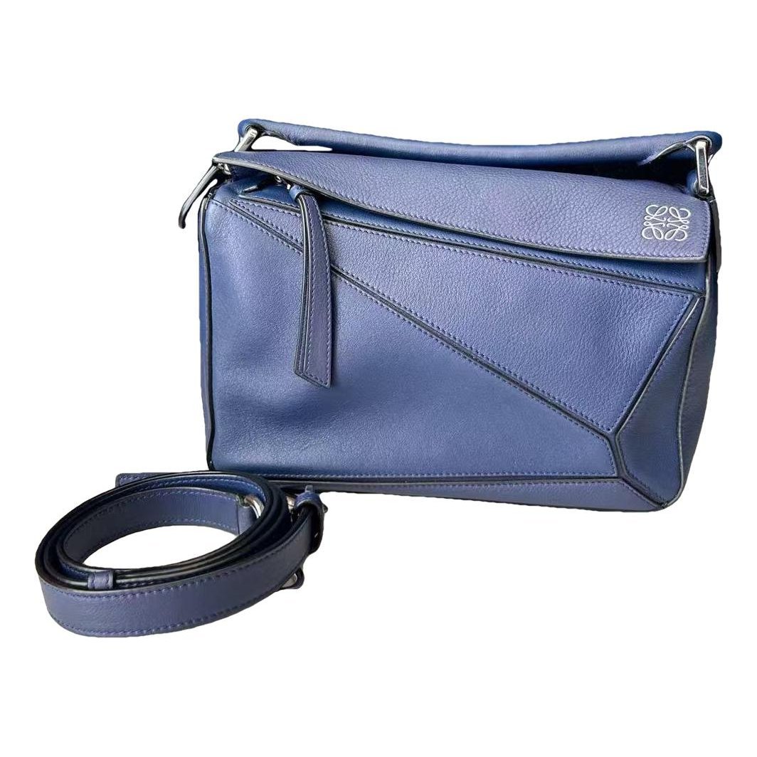 Puzzle leather handbag