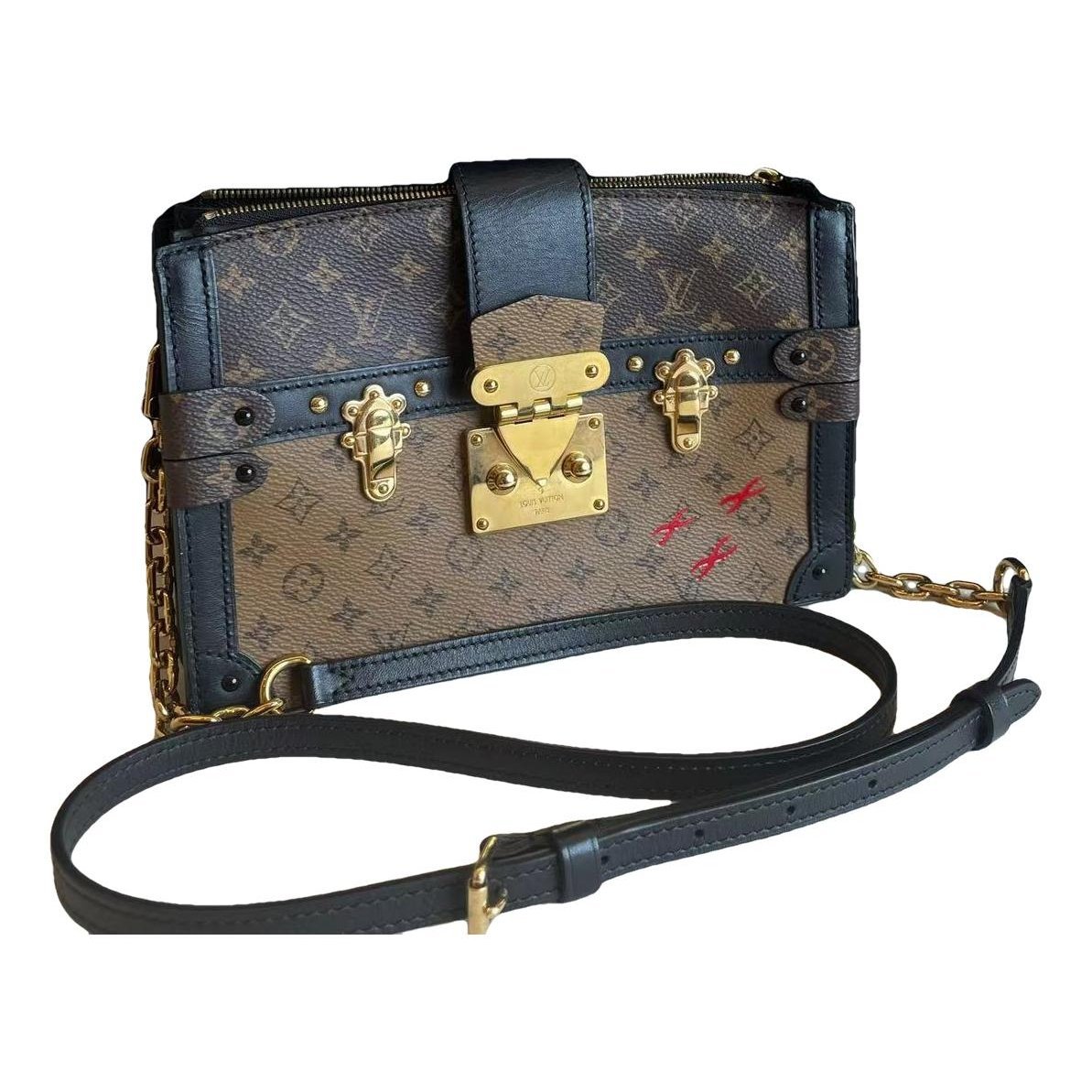 Pochette Trunk leather handbag