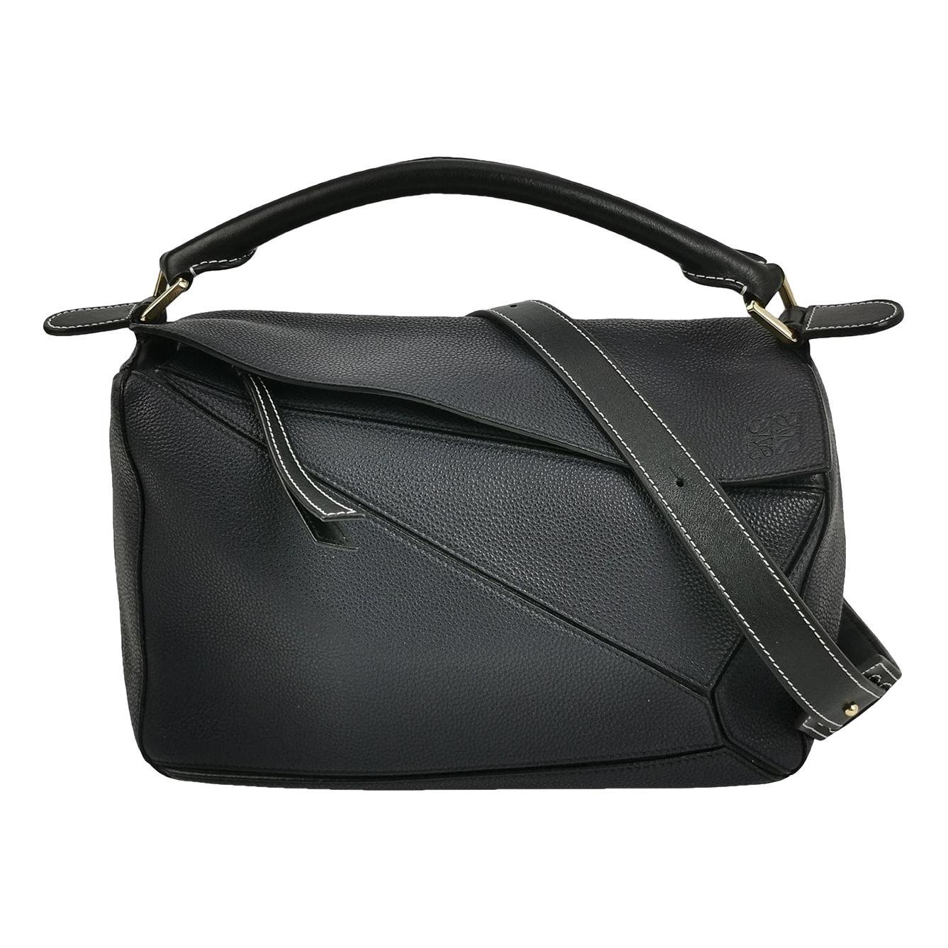 Puzzle leather handbag