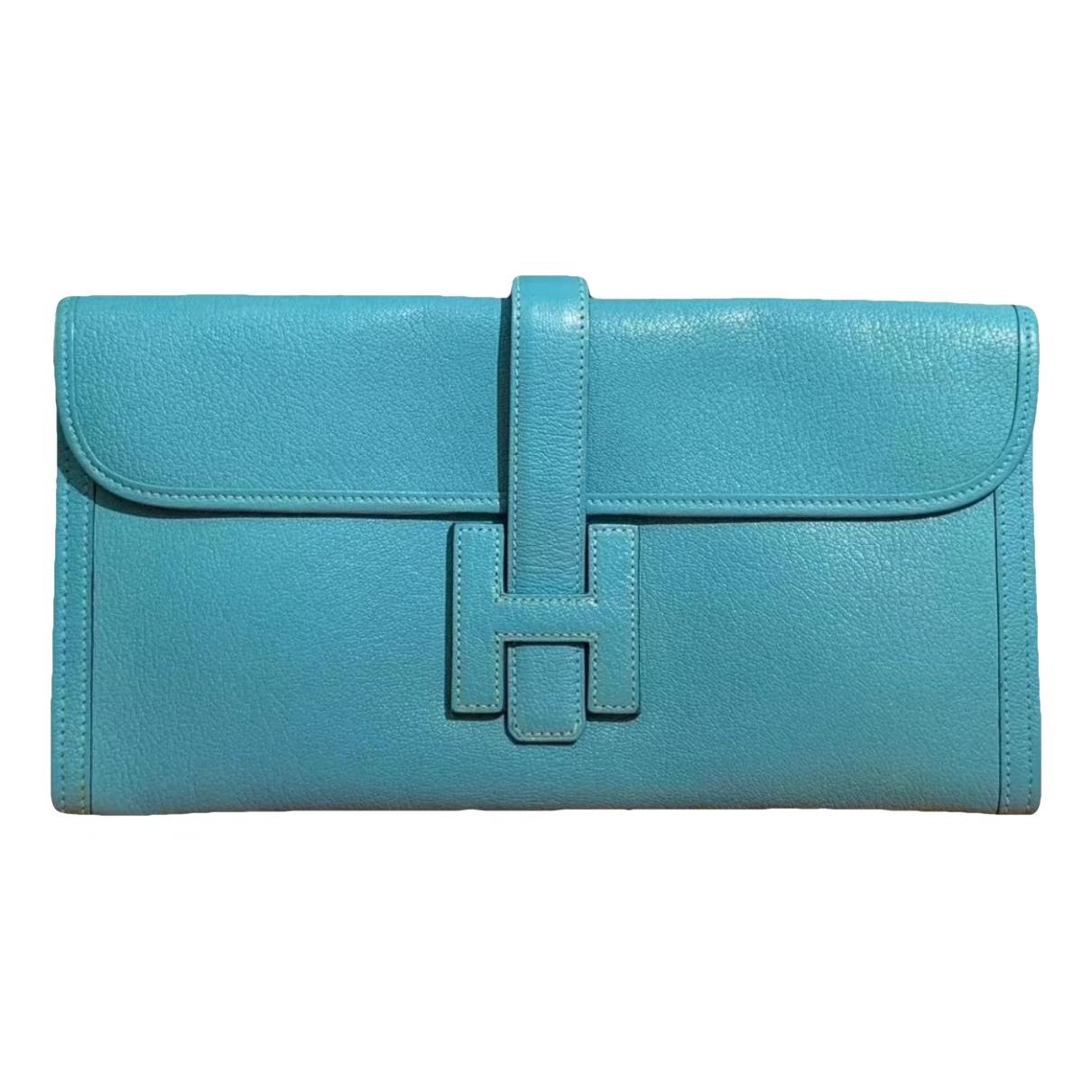 Jige leather clutch bag